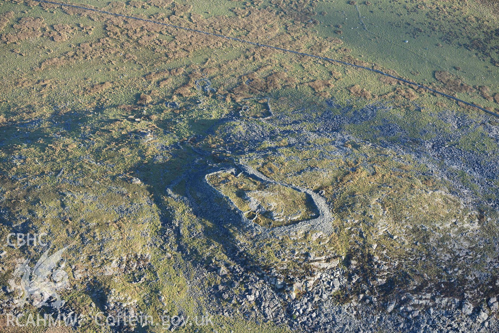 Oblique aerial photograph of Craig y Dinas hillfort and landscape, taken during the Royal Commission