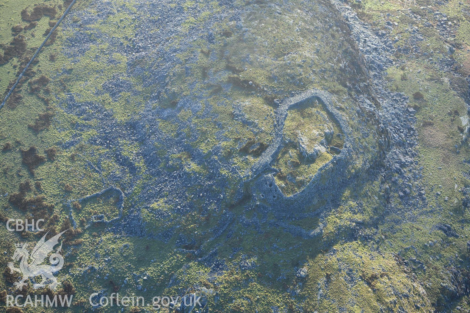 Oblique aerial photograph of Craig y Dinas hillfort and landscape, taken during the Royal Commission