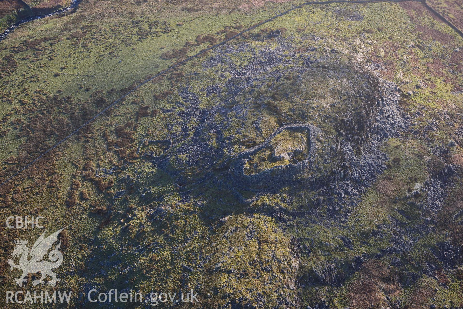 Oblique aerial photograph of Craig y Dinas hillfort and landscape, taken during the Royal Commission