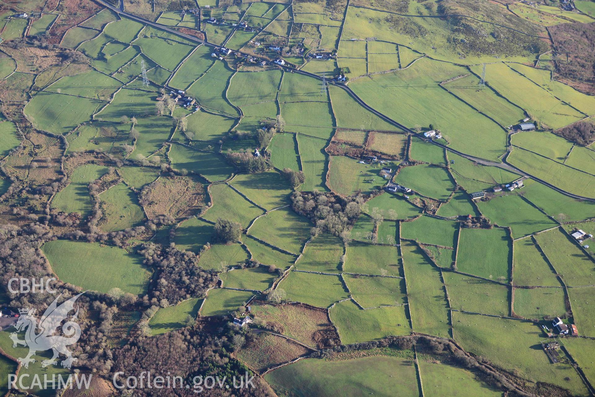 Oblique aerial photograph of Penygroes landscape, with settlement enclosure, Llwyn Du; west of Pen-yr-allt taken from north west during the Royal Commission