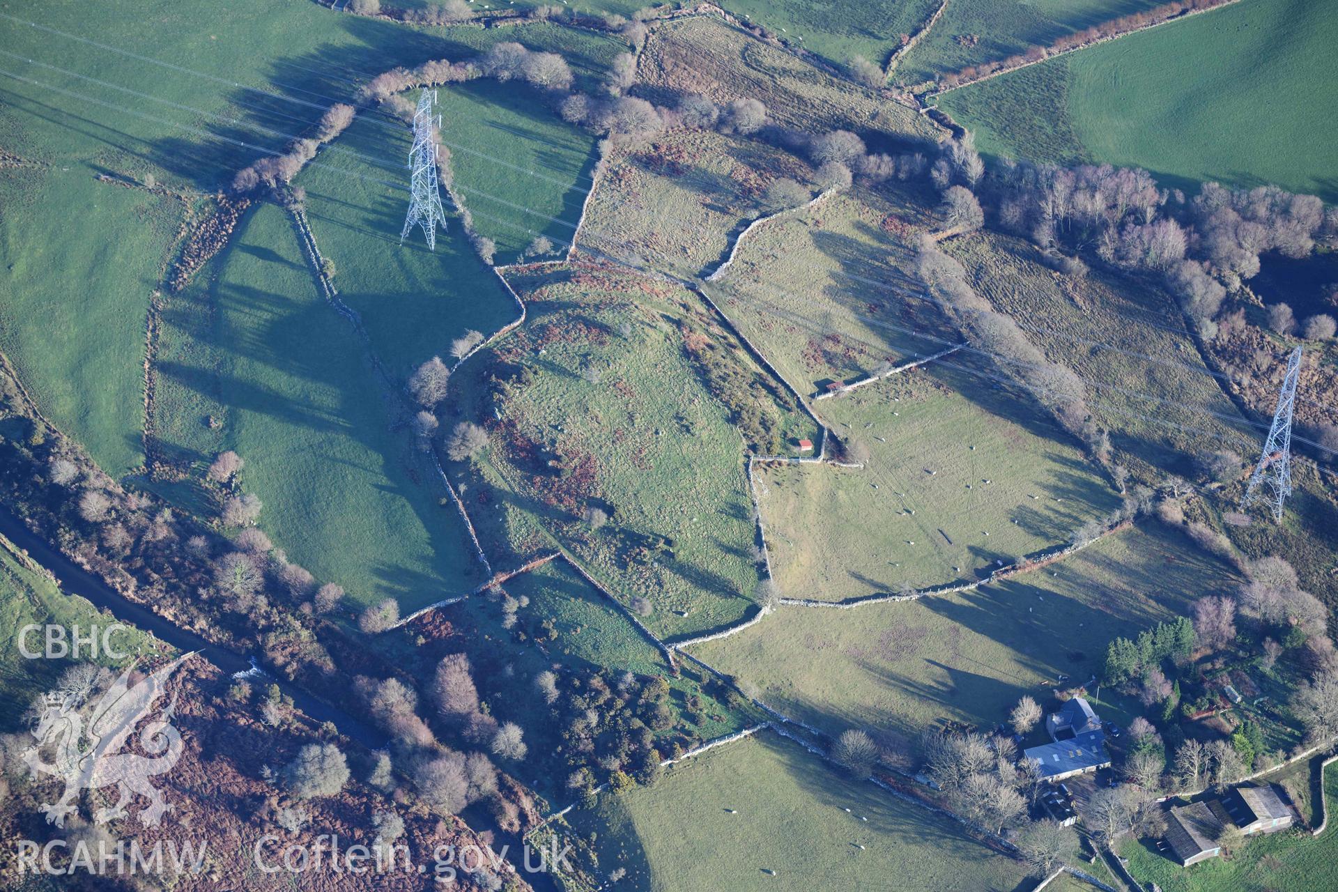 Oblique aerial photograph of Caerengan Hillfort taken during the Royal Commission