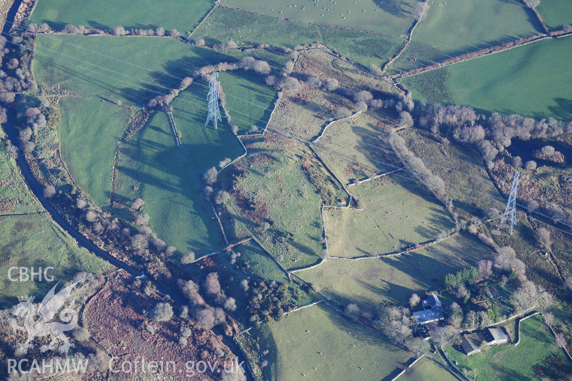 Oblique aerial photograph of Caerengan Hillfort taken during the Royal Commission