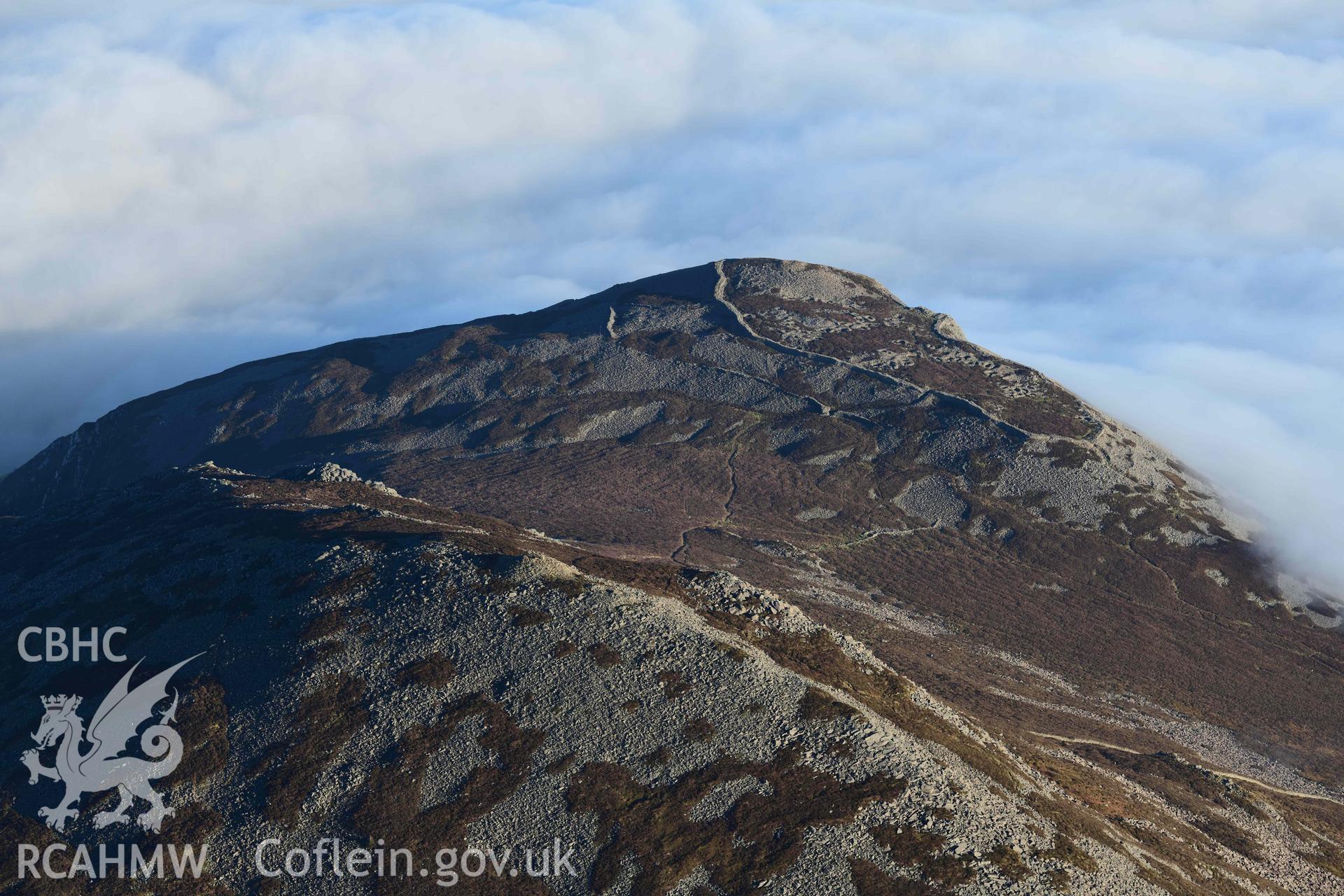 Oblique aerial photograph of Yr Eiffl summit cairn taken from the west during the Royal Commission