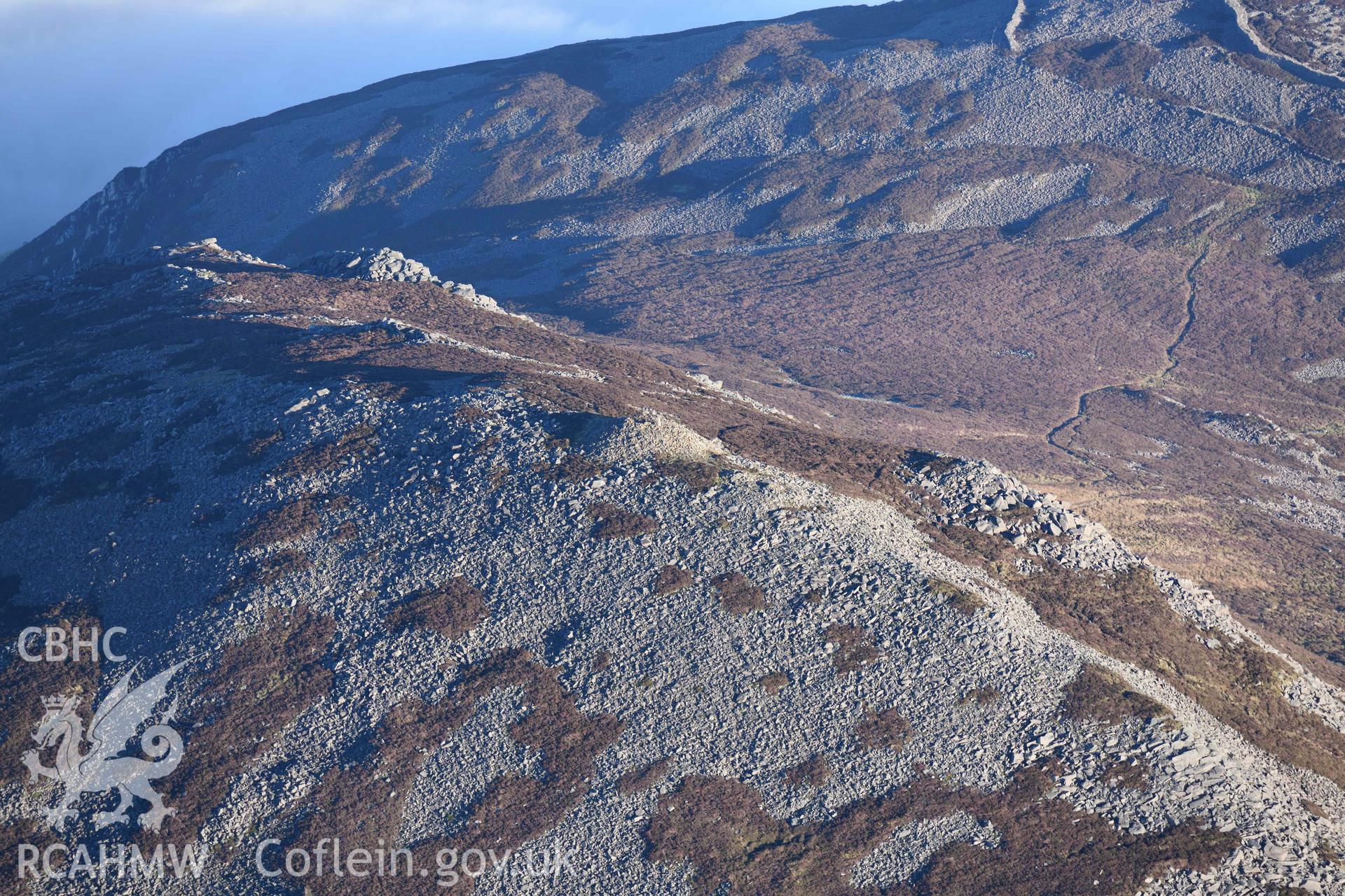 Oblique aerial photograph of Yr Eiffl summit cairn taken from the west during the Royal Commission