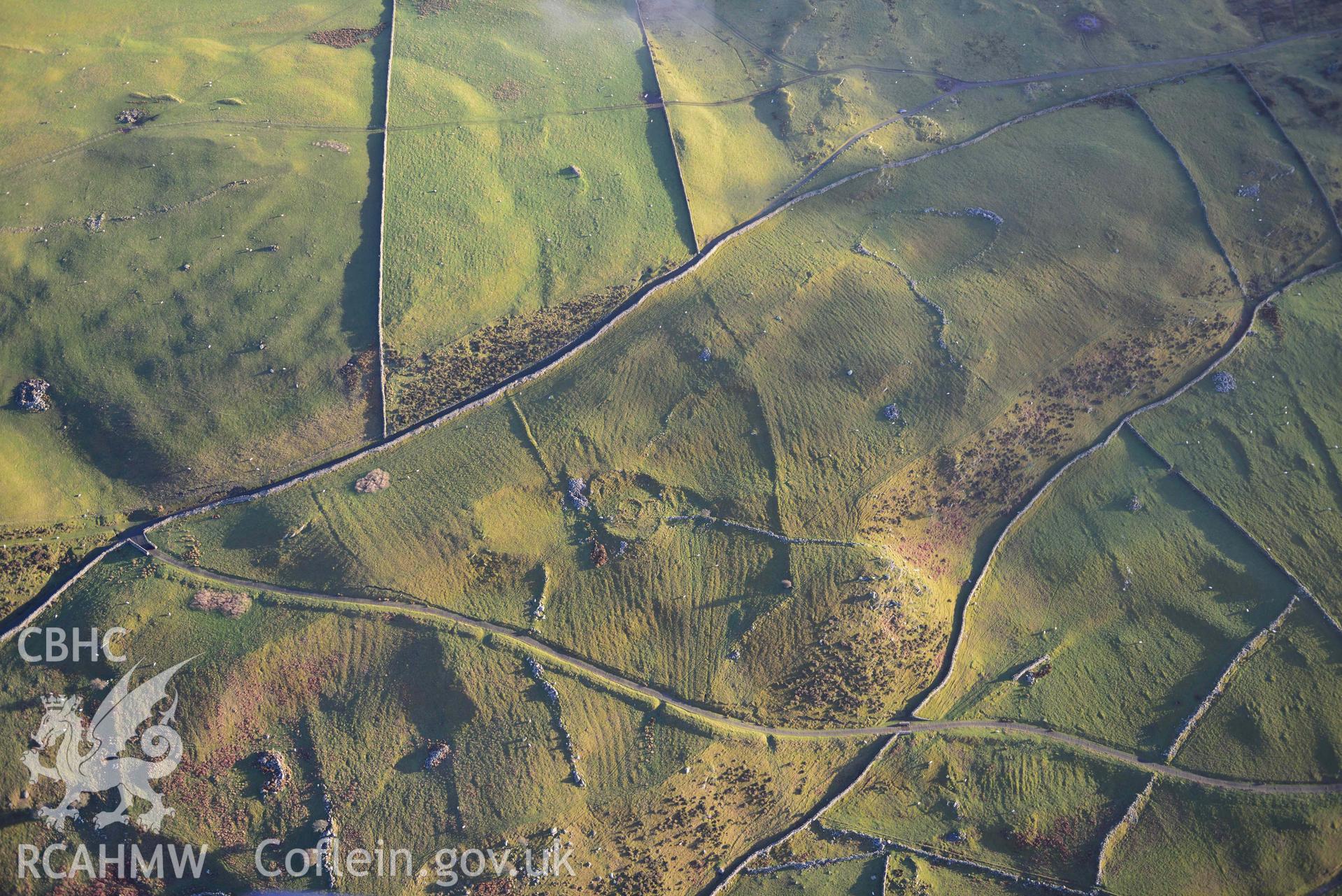 Oblique aerial photograph of Erw Wen prehistoric and medieval settlement, and fields. Taken during the Royal Commission