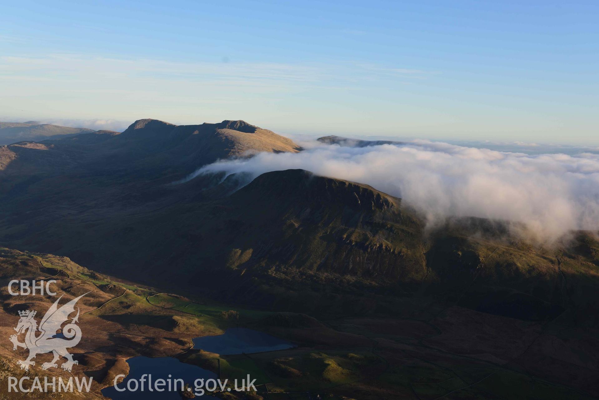 Oblique aerial photograph of Cader Idris, with cloud inversion, wide landscape from NW. Taken during the Royal Commission