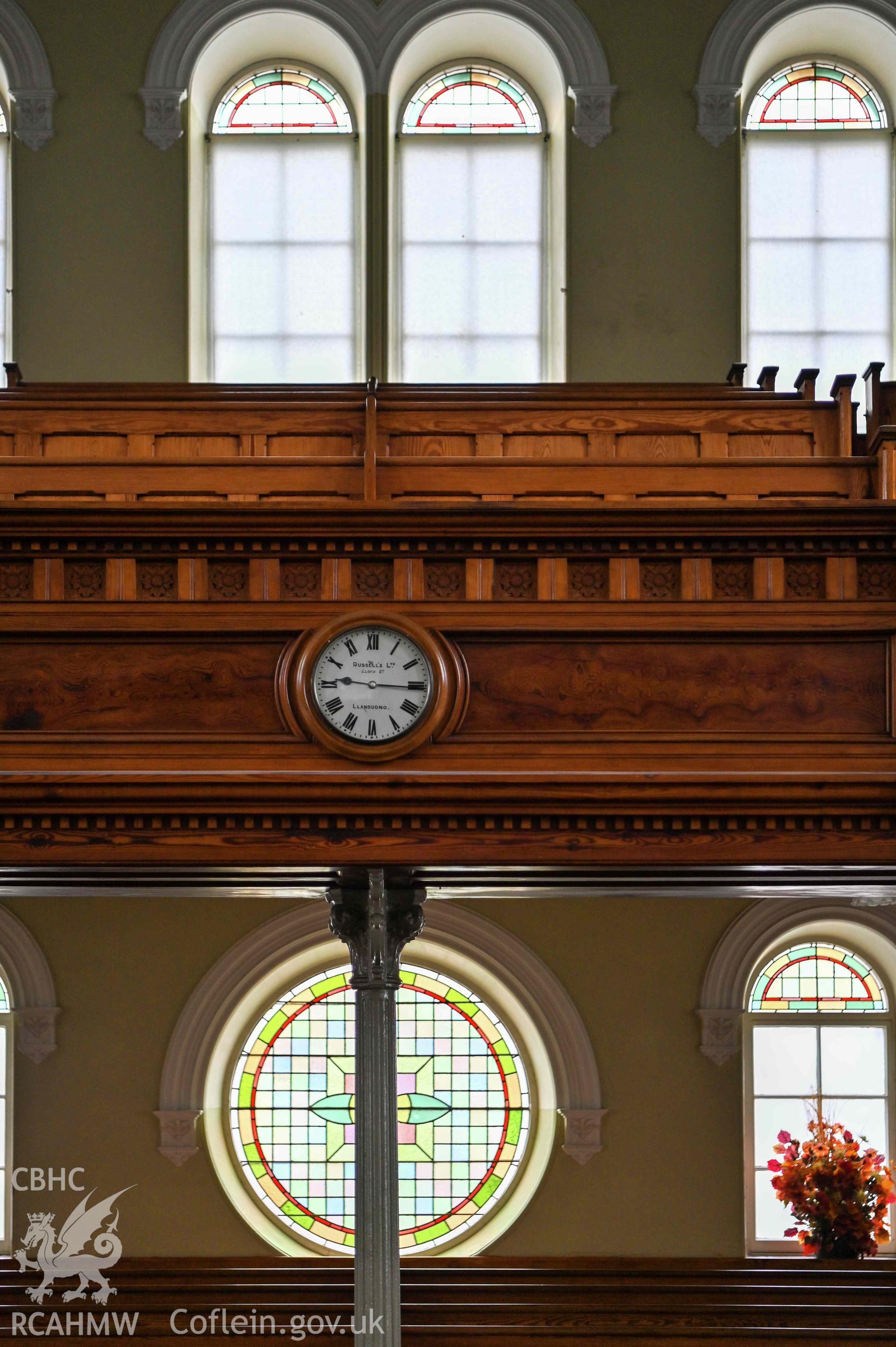Capel Moreia interior, detail of gallery front and gallery clock.