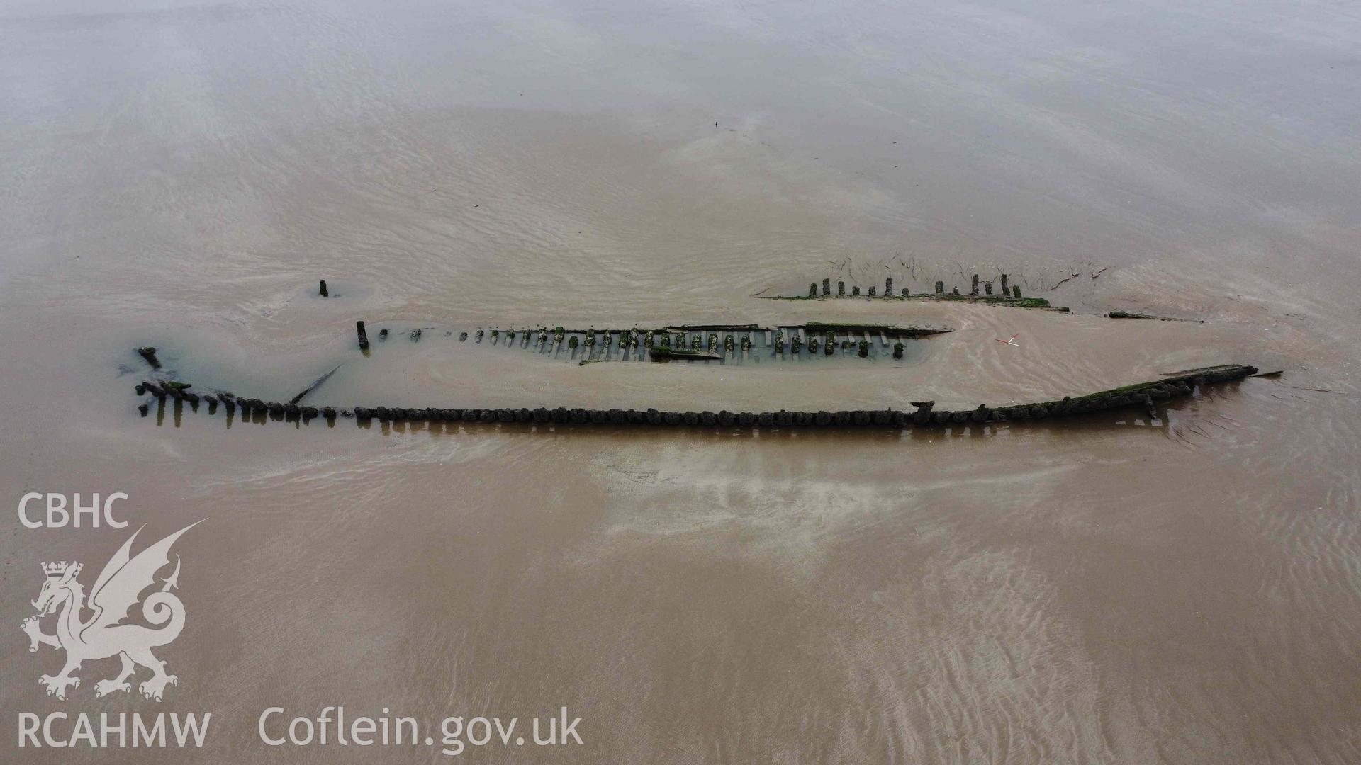 Cefn Sidan wreck 1. Oblique view looking from the starboard side on 21/02/2023. Bow is to the right, stern to the left. Scales are 1m.