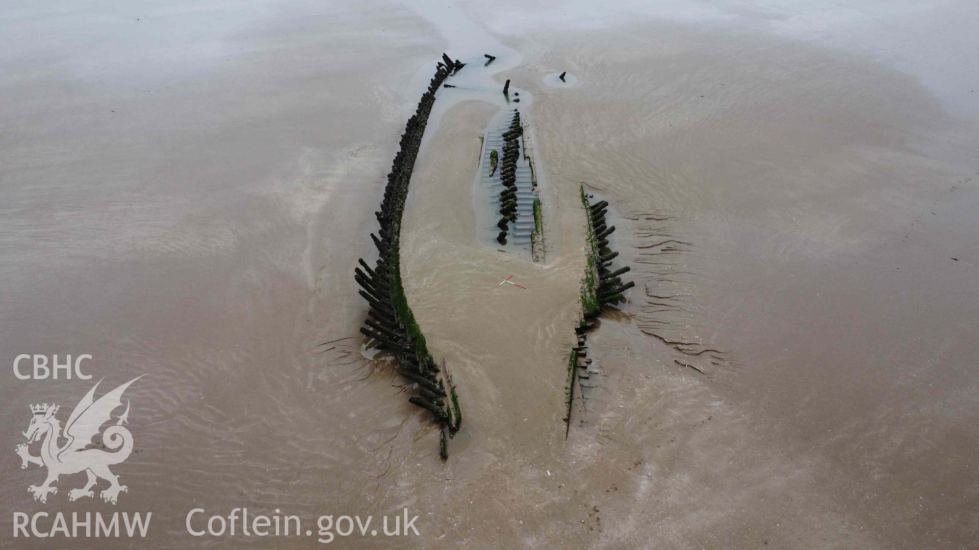 Cefn Sidan wreck 1. Oblique view looking south-west from the bow, towards the stern on 21/02/2023. Scales are 1m.