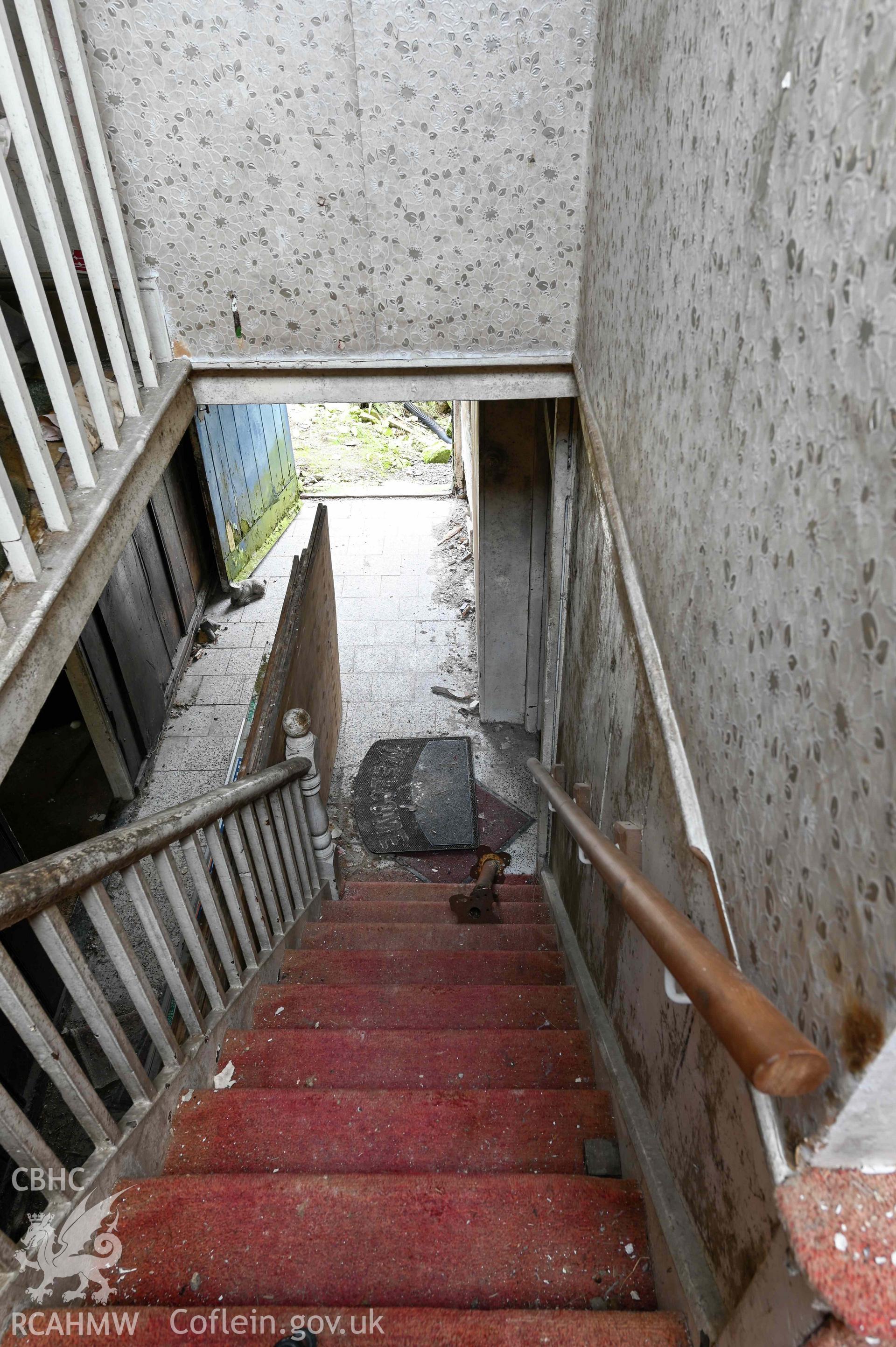 Tyddyn Mawr, interior view from first floor landing down stairs to ground floor hall.