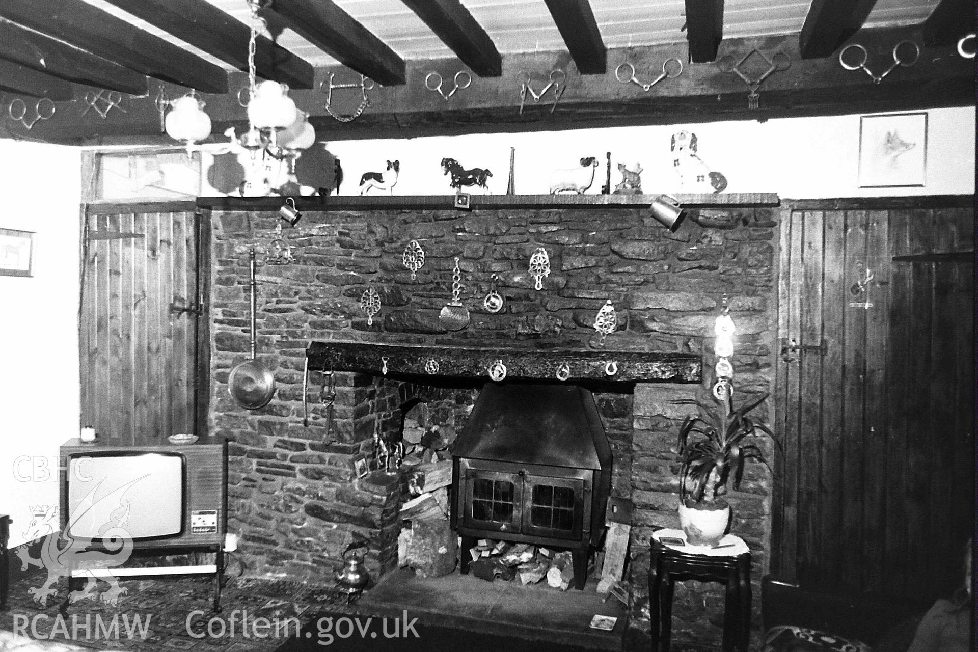 Digitised black and white photograph showing interior of living room at Fforch Farm, produced by Paul Davis in 1984