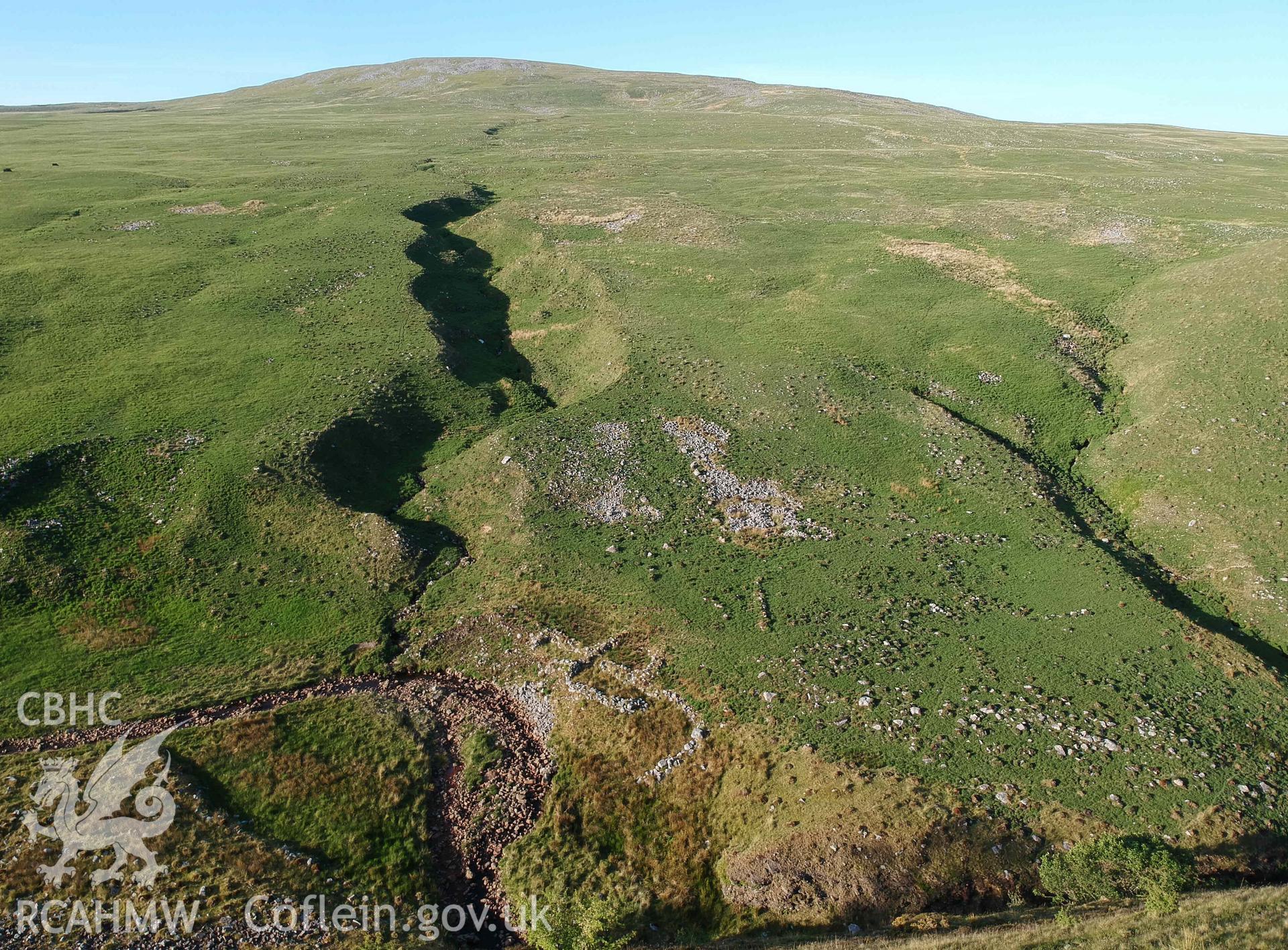 Digital photograph showing general view of Cwm Garw longhuts. Produced by Paul Davis in 2020
