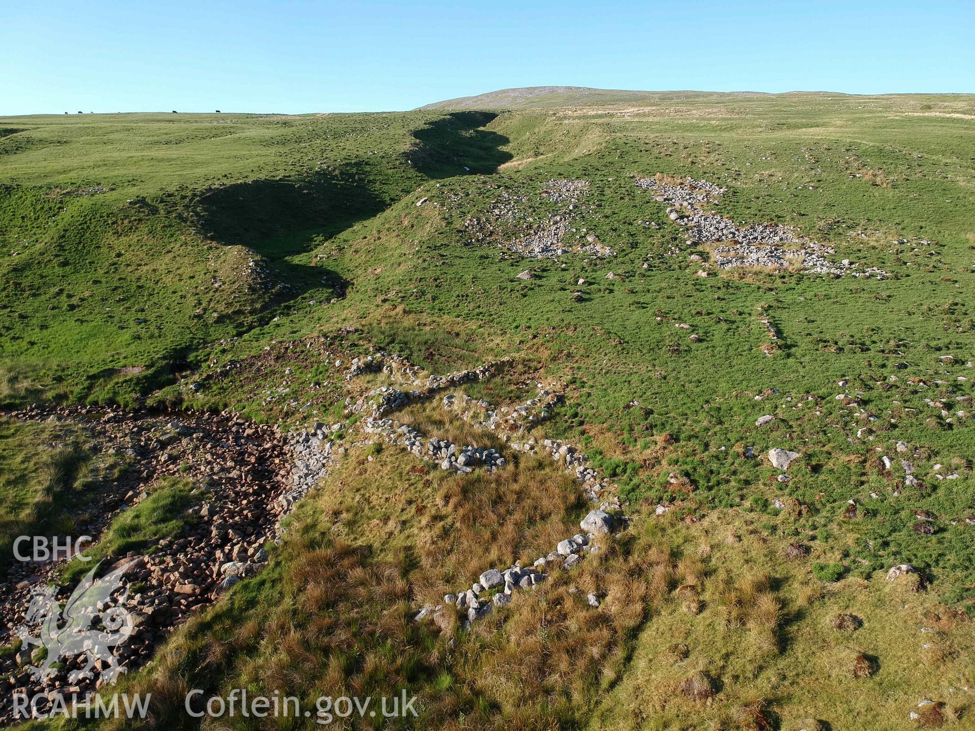Digital photograph showing detailed view of Cwm Garw longhuts. Produced by Paul Davis in 2020