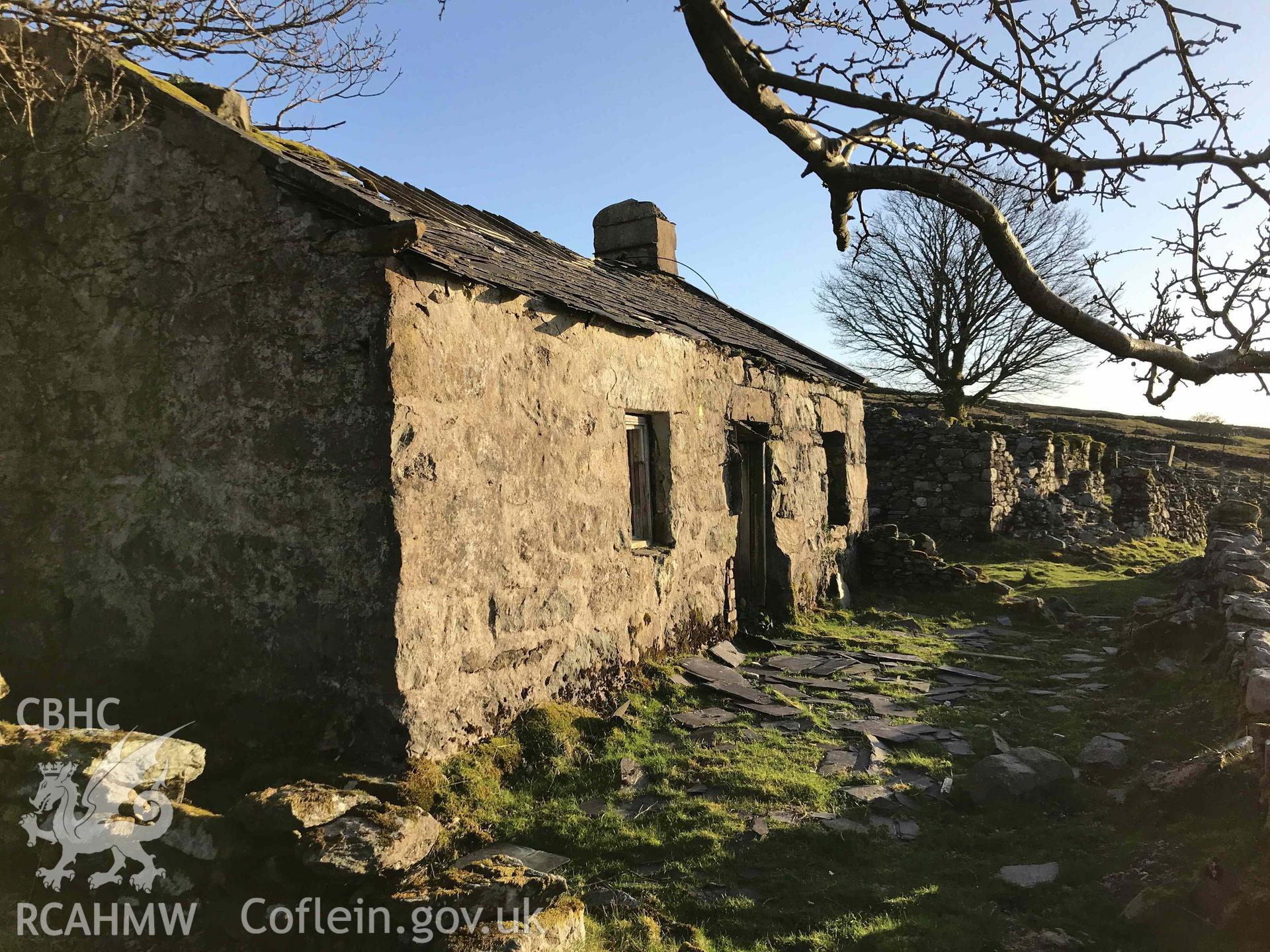 Digital photograph showing front elevation and front yard of Bryn-brith, a cottage at Dinorwig deserted settlement, produced by Paul Davis in 2020