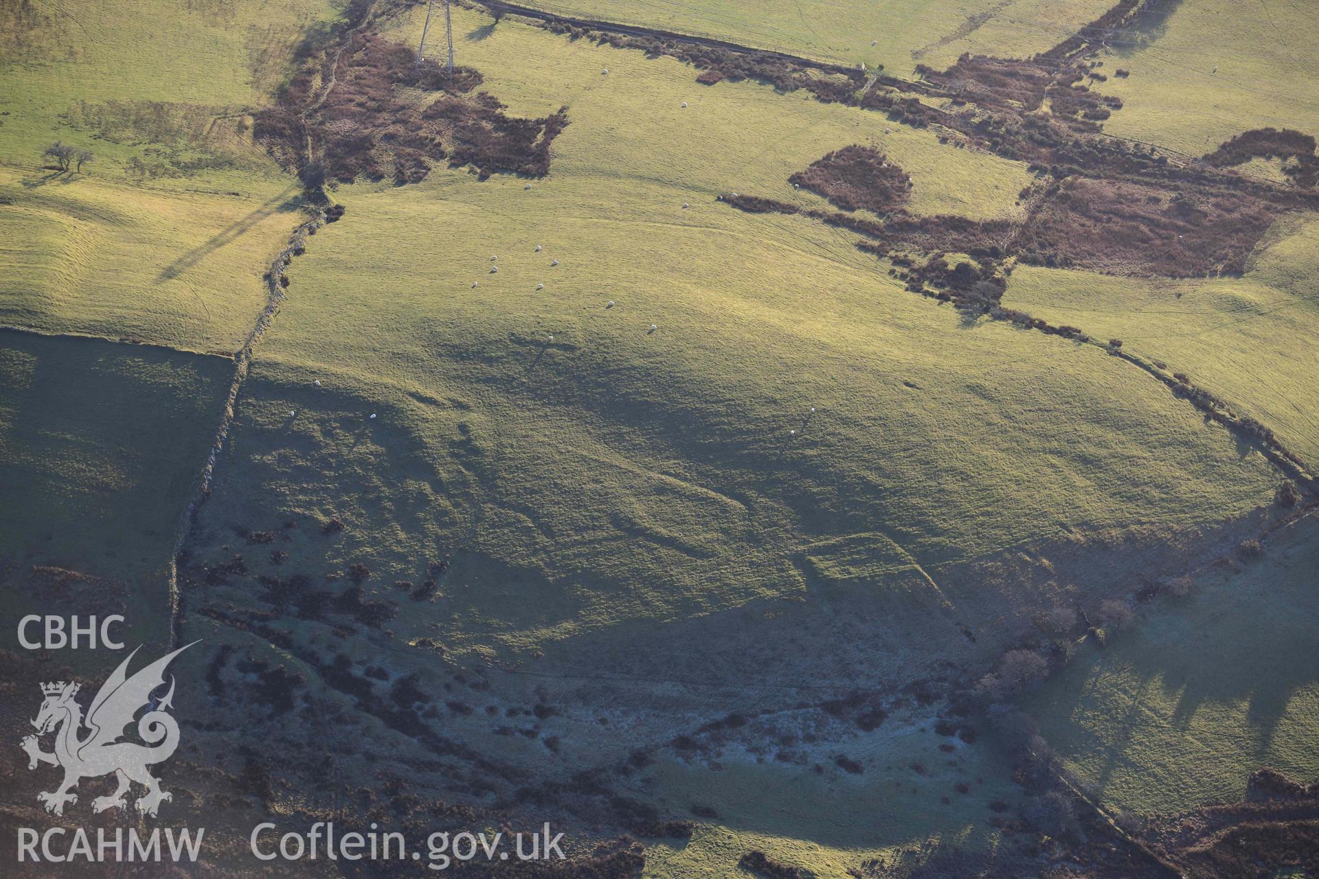 Oblique aerial photograph of Tomen y Mur practice works and annex to the north west. Taken during the Royal Commission’s programme of archaeological aerial reconnaissance by Toby Driver on 17th January 2022