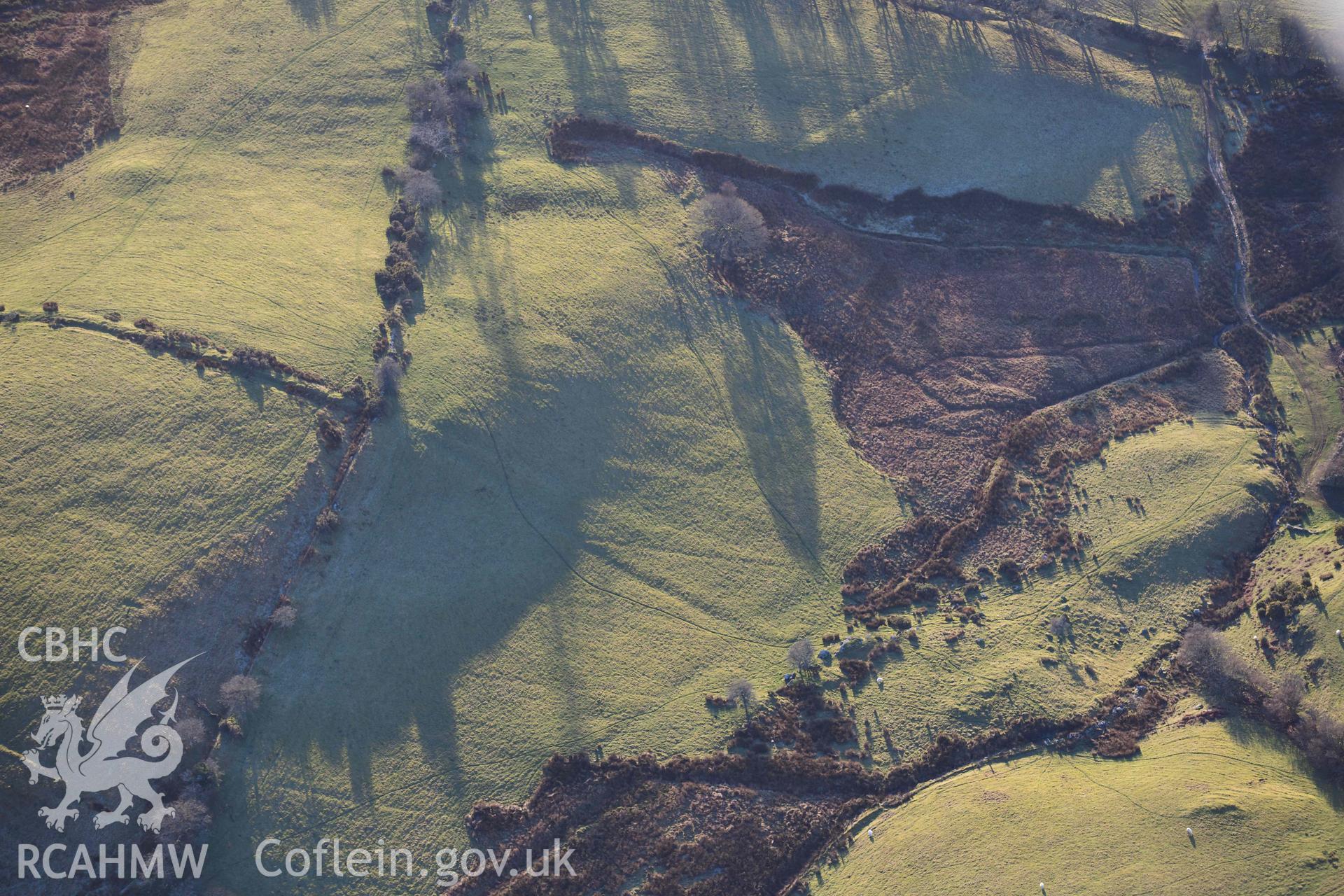Oblique aerial photograph of Tomen y Mur practice works and annex to the north west. Taken during the Royal Commission’s programme of archaeological aerial reconnaissance by Toby Driver on 17th January 2022