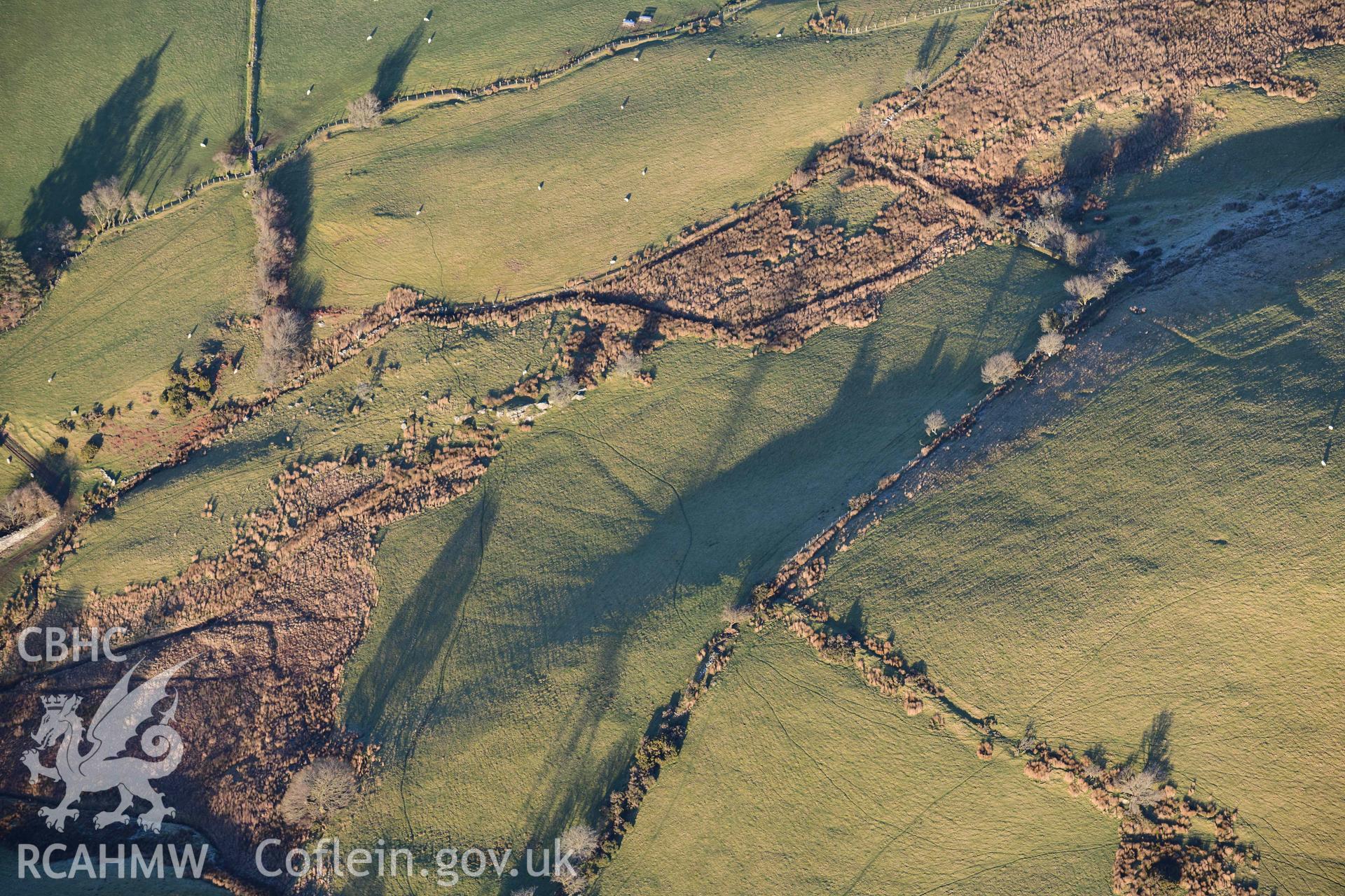 Oblique aerial photograph of Tomen y Mur practice works and annex to the north west. Taken during the Royal Commission’s programme of archaeological aerial reconnaissance by Toby Driver on 17th January 2022