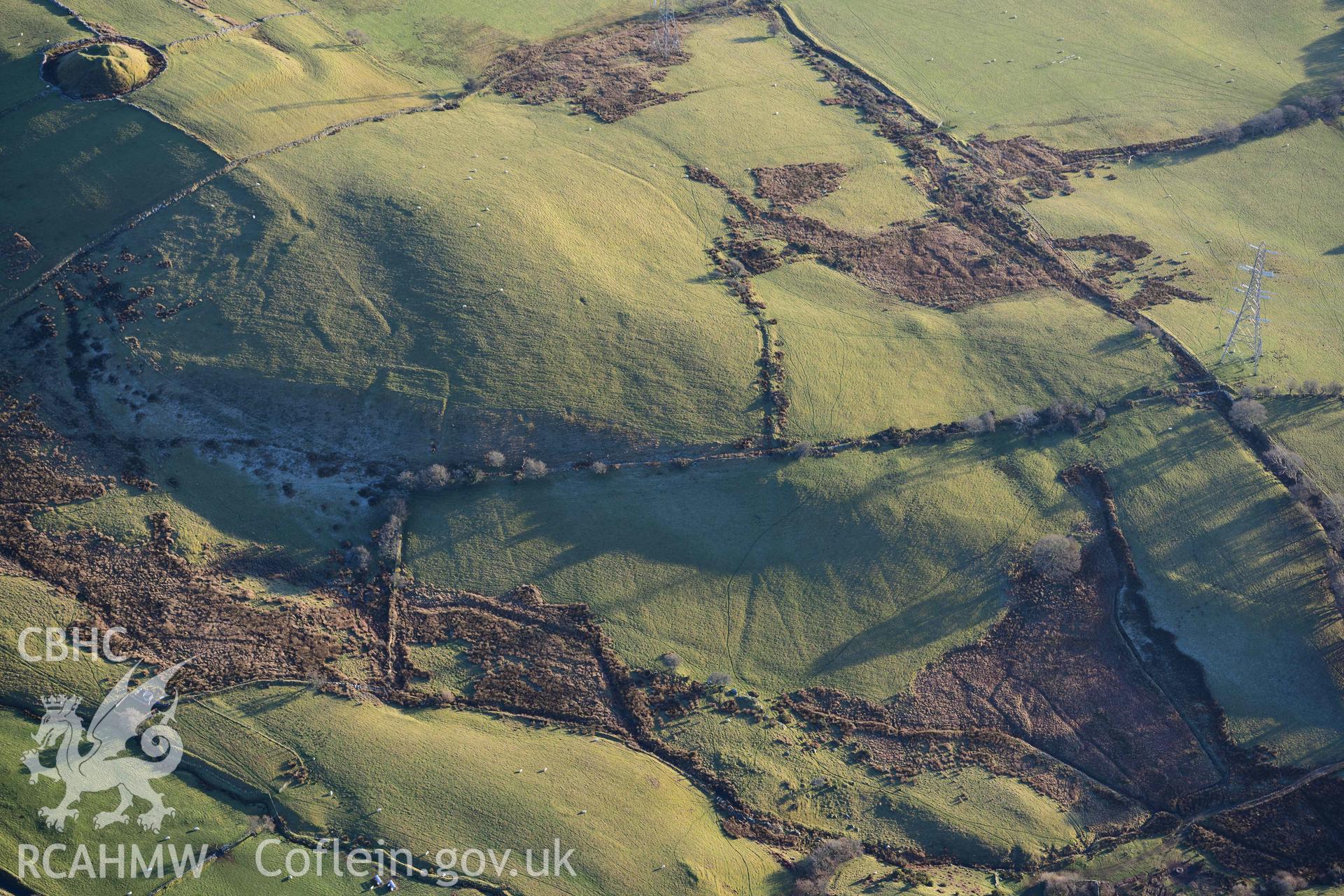 Oblique aerial photograph of Tomen y Mur practice works and annex to the north west. Taken during the Royal Commission’s programme of archaeological aerial reconnaissance by Toby Driver on 17th January 2022