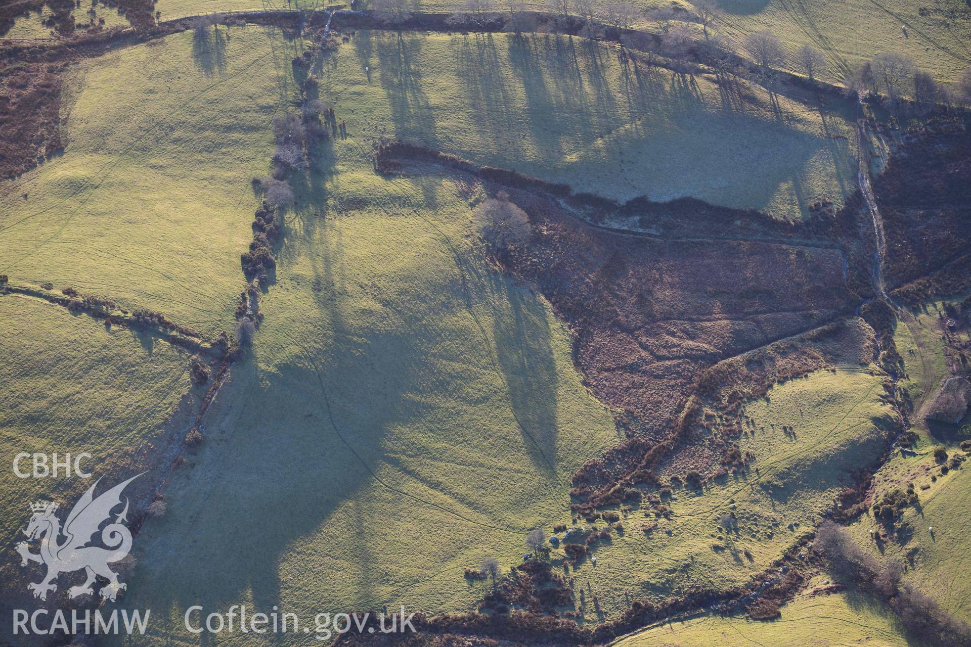 Oblique aerial photograph of Tomen y Mur practice works and annex to the north west. Taken during the Royal Commission’s programme of archaeological aerial reconnaissance by Toby Driver on 17th January 2022