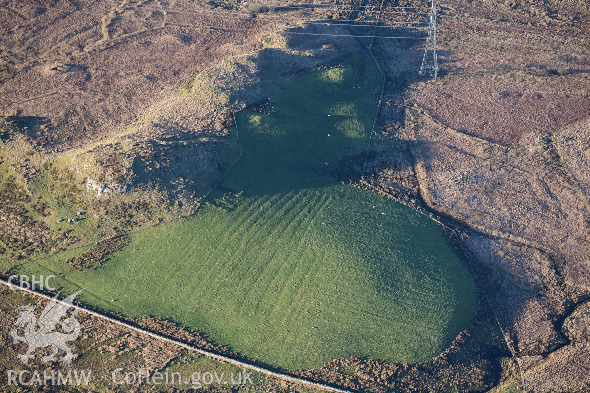 Oblique aerial photograph of Dolbelydr platform houses and fields taken during the Royal Commission’s programme of archaeological aerial reconnaissance by Toby Driver on 17th January 2022