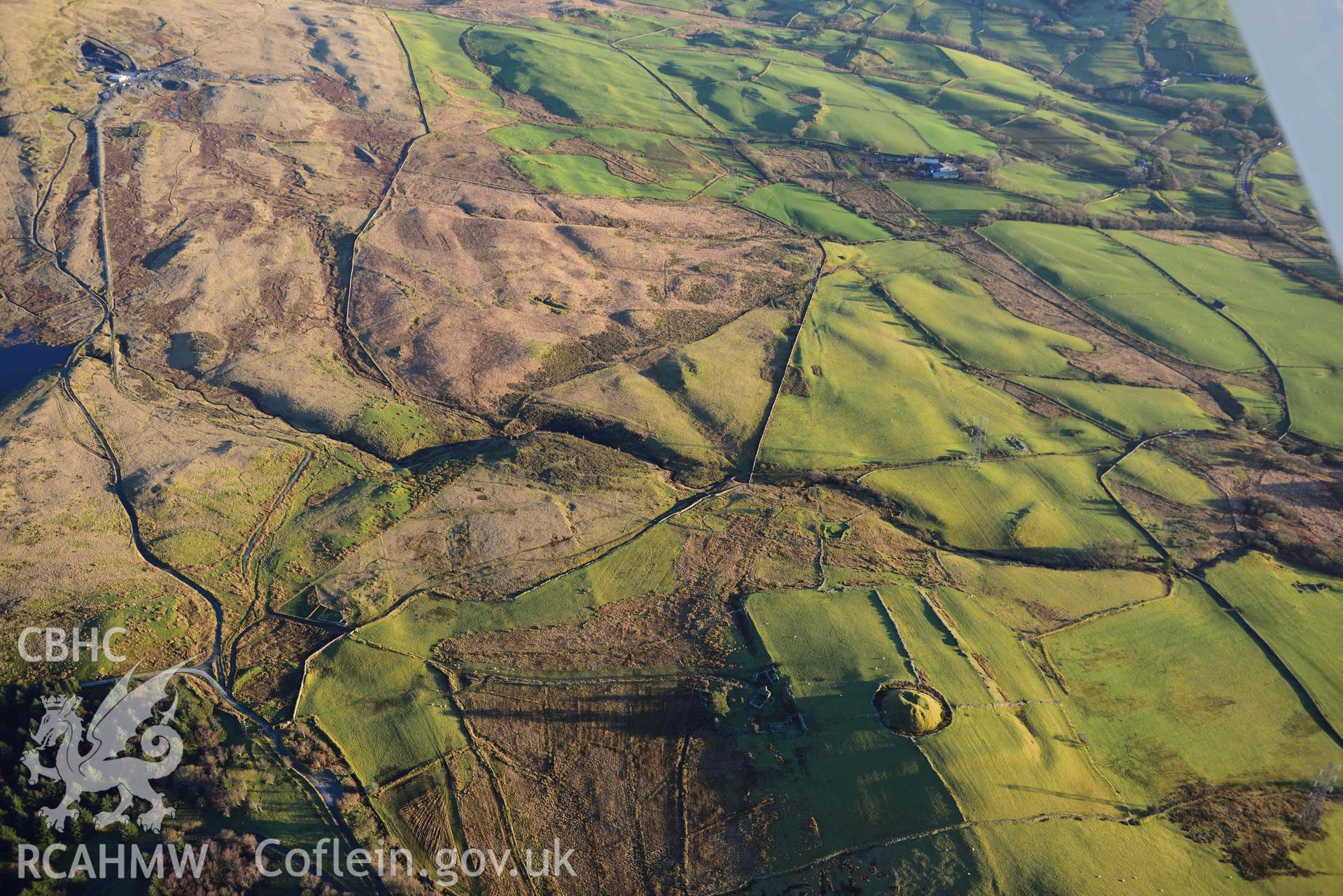 Oblique aerial photograph of Tomen y Mur Roman fort and earthwork complex. Taken during the Royal Commission’s programme of archaeological aerial reconnaissance by Toby Driver on 17th January 2022