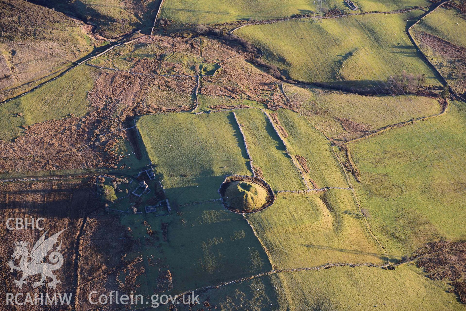 Oblique aerial photograph of Tomen y Mur Roman fort and earthwork complex. Taken during the Royal Commission’s programme of archaeological aerial reconnaissance by Toby Driver on 17th January 2022
