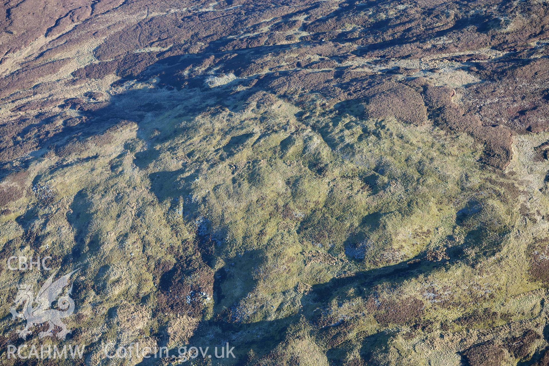 Oblique aerial photograph showing general location of Hengwm Cairn taken from the south west, during the Royal Commission’s programme of archaeological aerial reconnaissance by Toby Driver on 17th January 2022