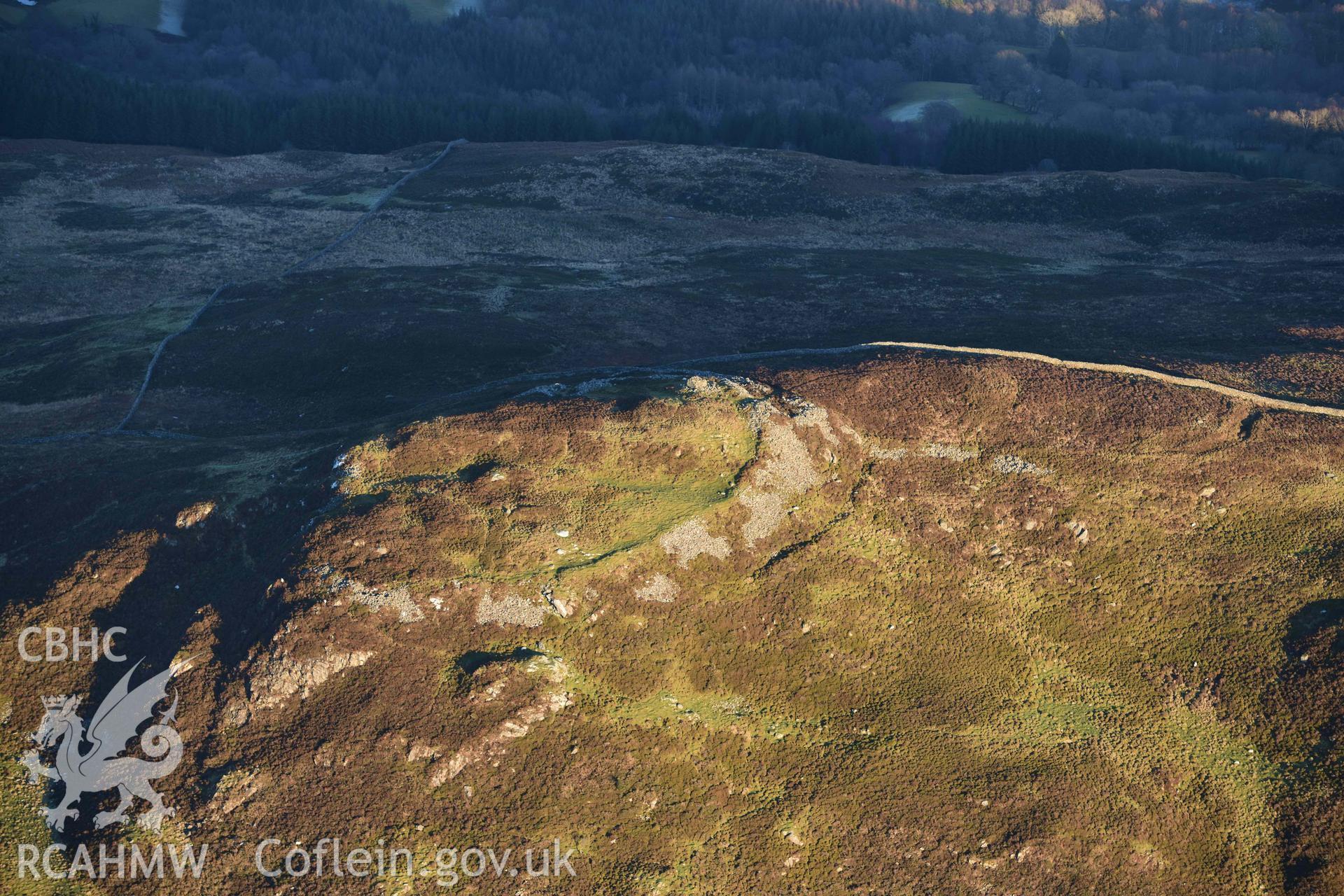 Oblique aerial photograph of Moel Offrwm taken from the west during the Royal Commission’s programme of archaeological aerial reconnaissance by Toby Driver on 17th January 2022