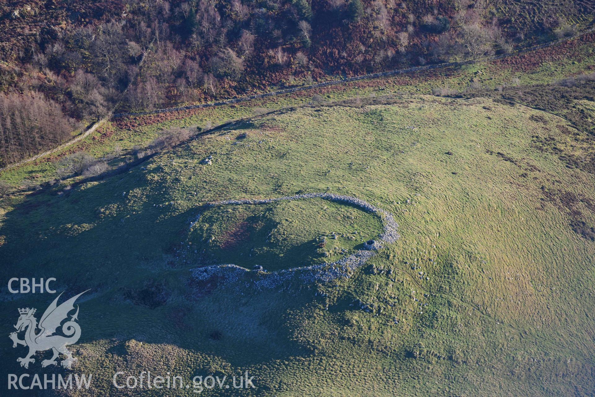 Oblique aerial photograph of Foel Fanner hillfort taken during the Royal Commission’s programme of archaeological aerial reconnaissance by Toby Driver on 17th January 2022