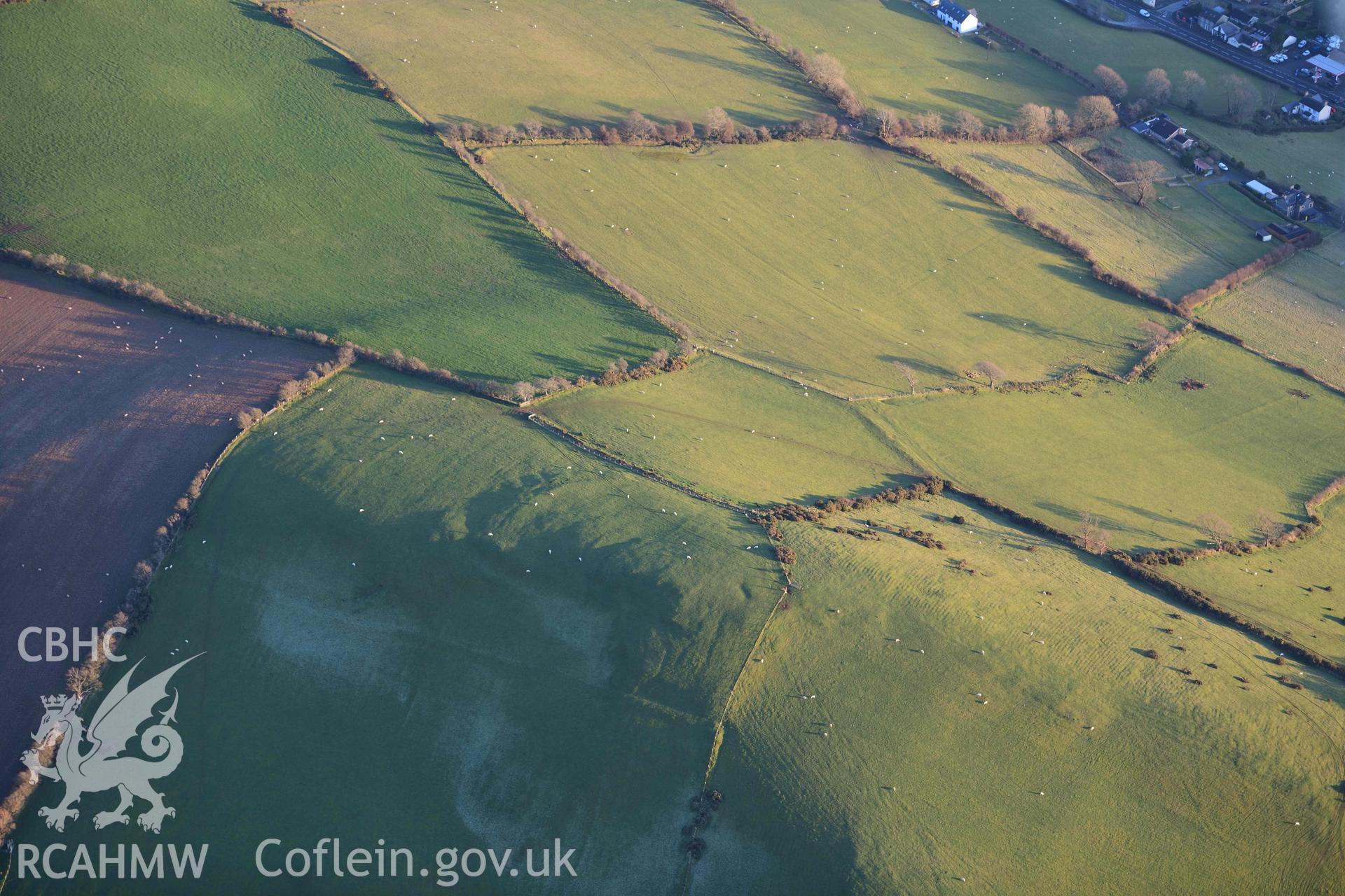 Oblique aerial photograph of Caerau Capel Bangor taken during the Royal Commission’s programme of archaeological aerial reconnaissance by Toby Driver on 17th January 2022