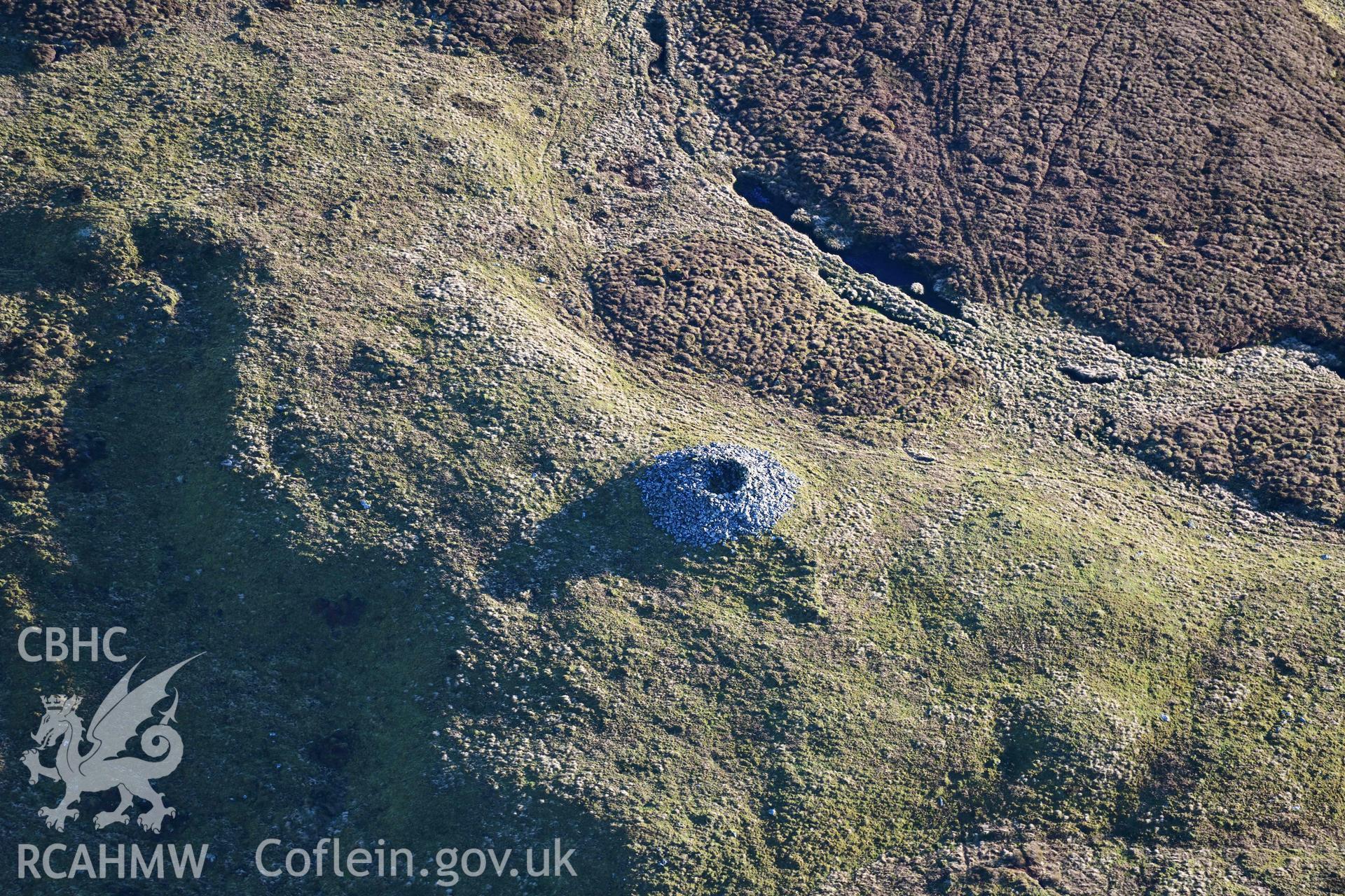 Oblique aerial photograph of Carn Fawr cairns taken during the Royal Commission’s programme of archaeological aerial reconnaissance by Toby Driver on 17th January 2022