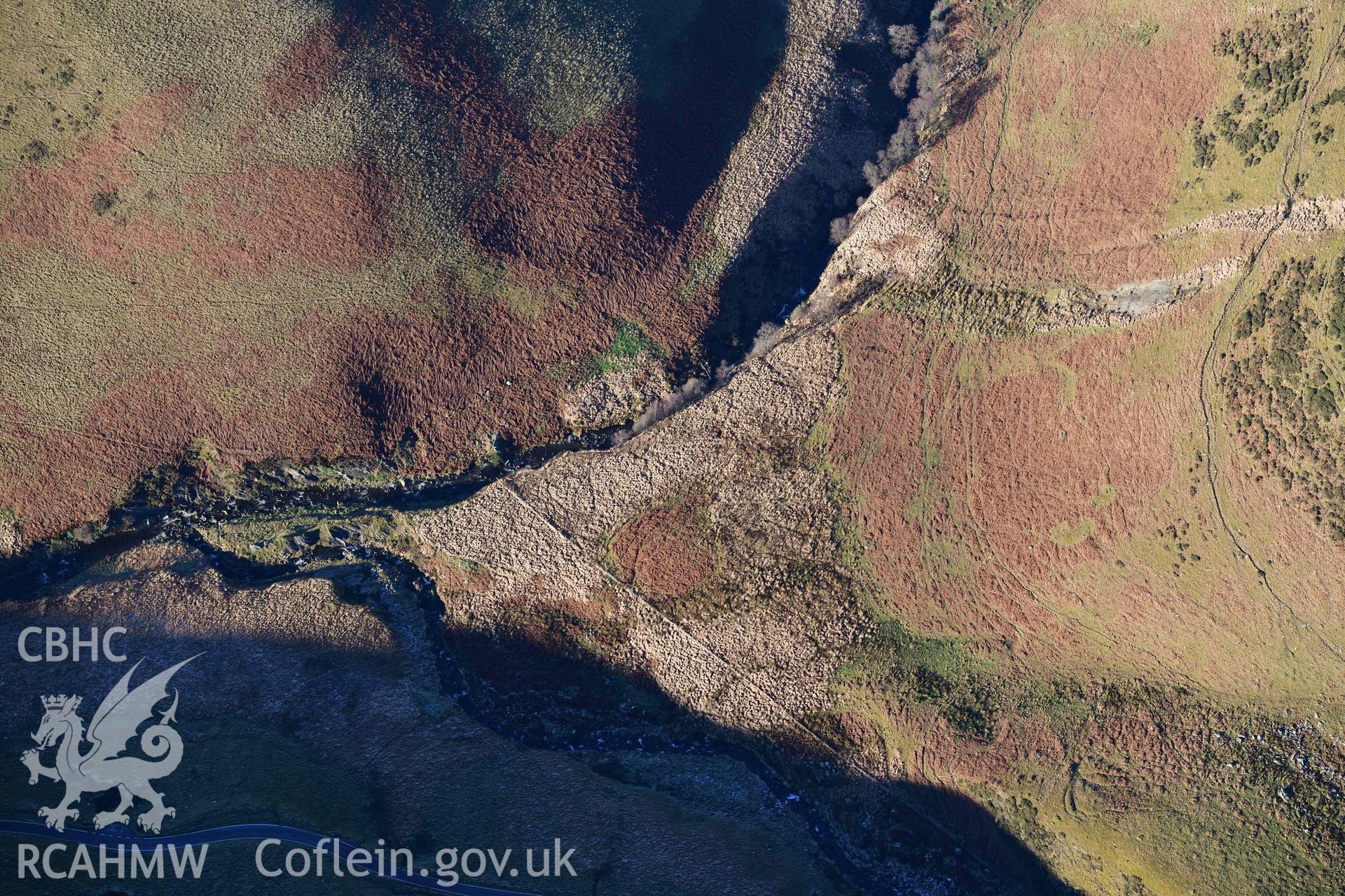 Oblique aerial photograph of Esgair Las inscribed animal head taken during the Royal Commission’s programme of archaeological aerial reconnaissance by Toby Driver on 17th January 2022