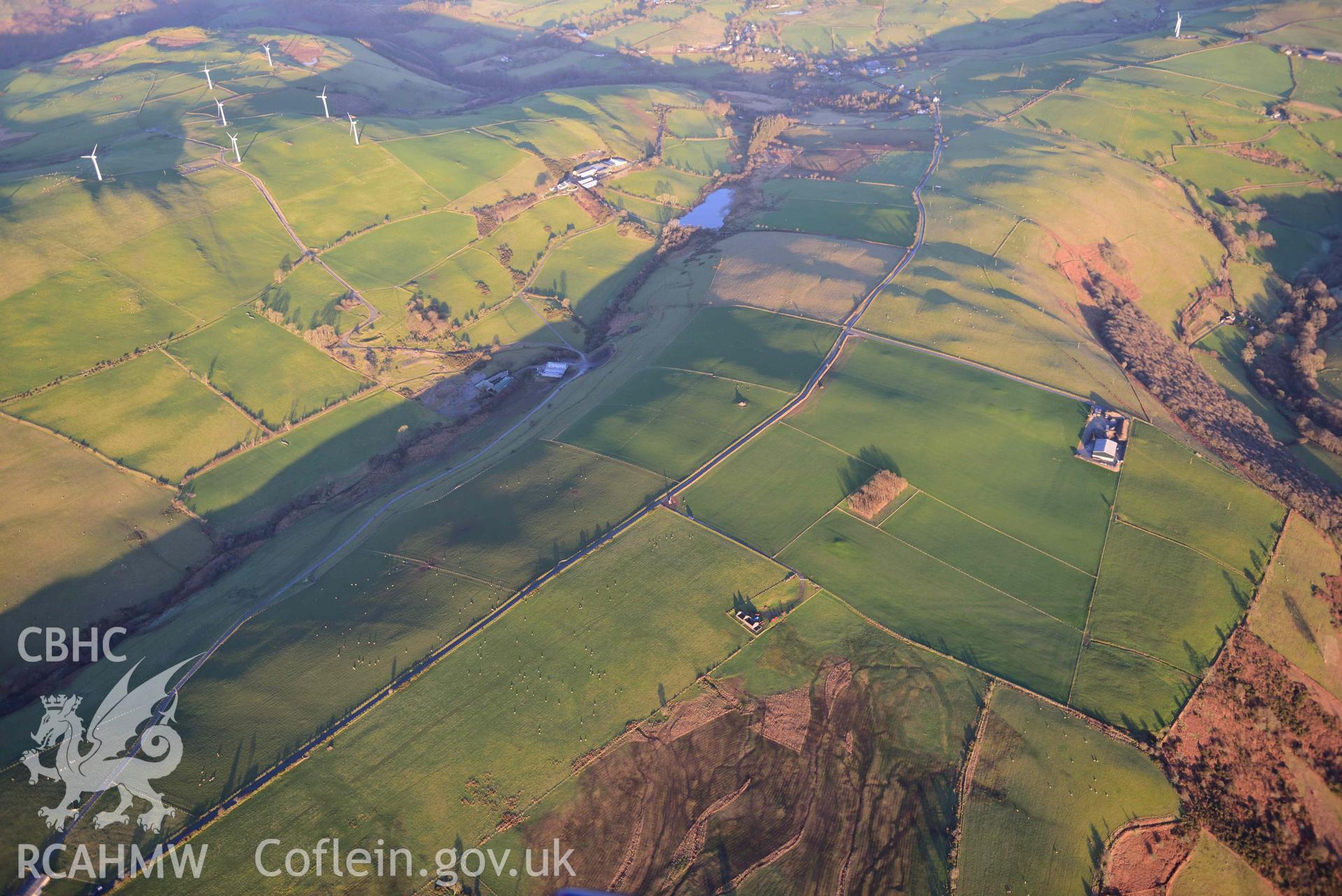 Oblique aerial photograph of Banc Troed Rhiw Seiri round barrow and other barrow earthworks. Taken during the Royal Commission’s programme of archaeological aerial reconnaissance by Toby Driver on 17th January 2022