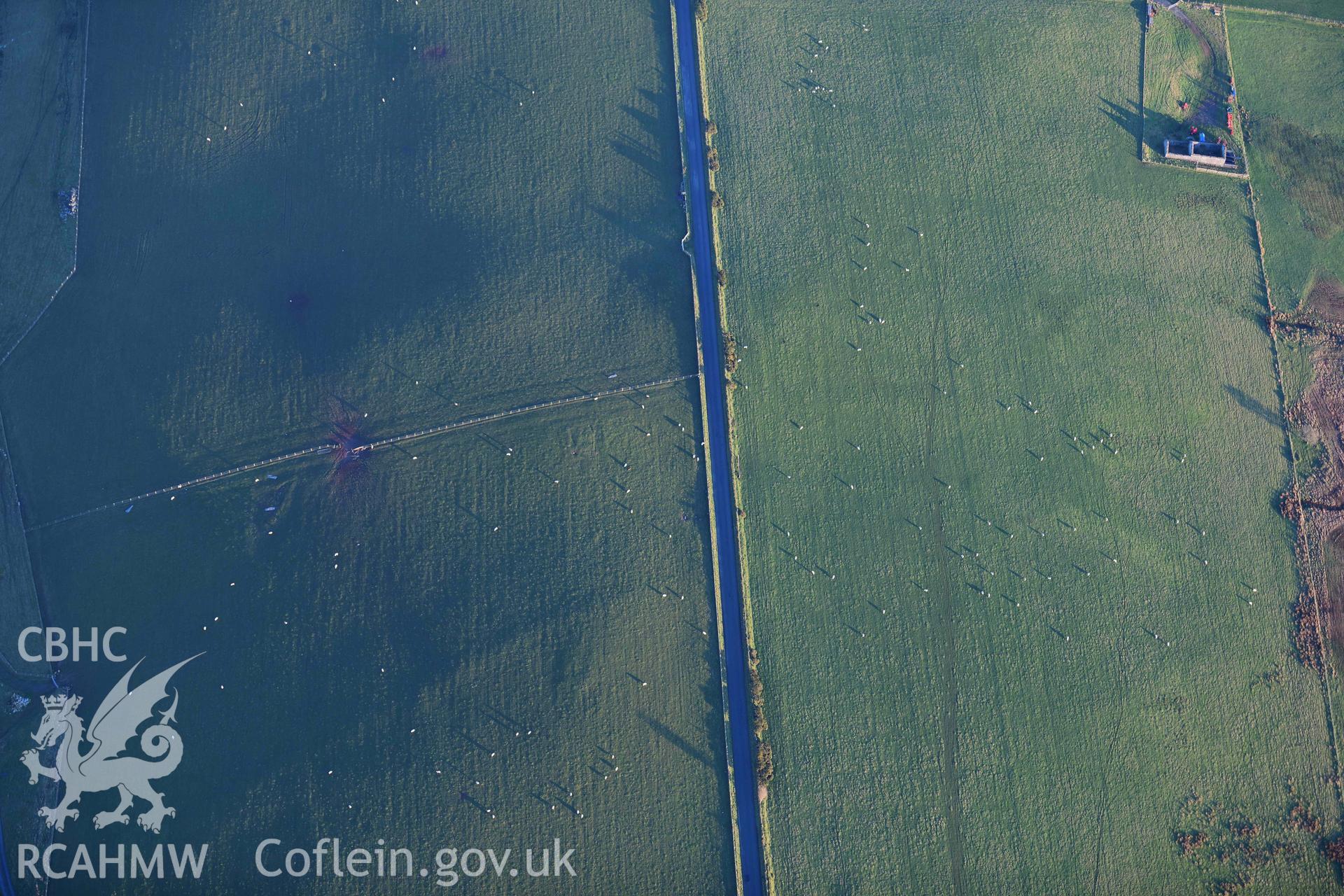 Oblique aerial photograph of earthworks to the west of Banc Troed Rhiw Seiri round barrow. Taken during the Royal Commission’s programme of archaeological aerial reconnaissance by Toby Driver on 17th January 2022