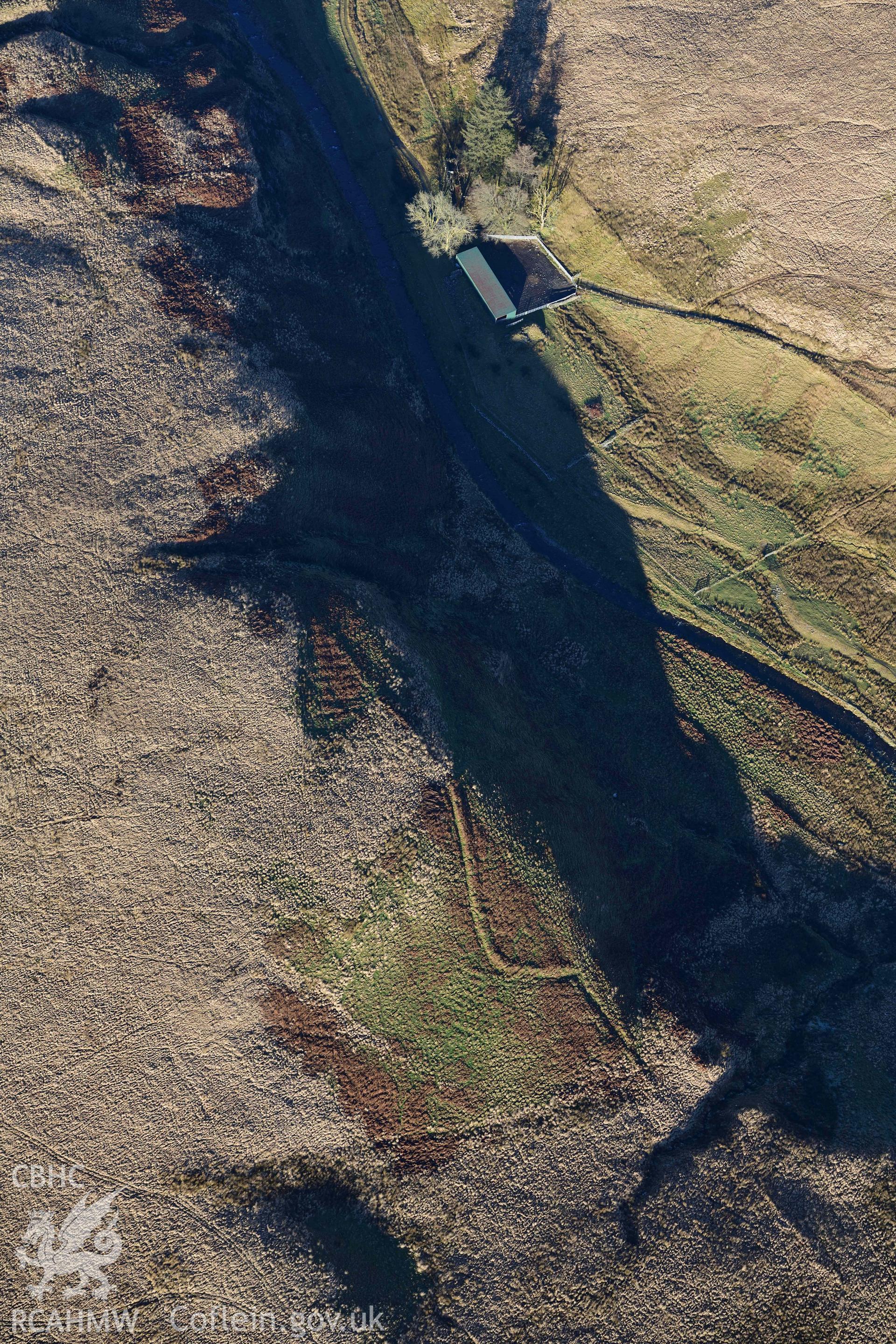 Oblique aerial photograph of cultivation features at Lluest Dolgwiail taken during the Royal Commission’s programme of archaeological aerial reconnaissance by Toby Driver on 17th January 2022