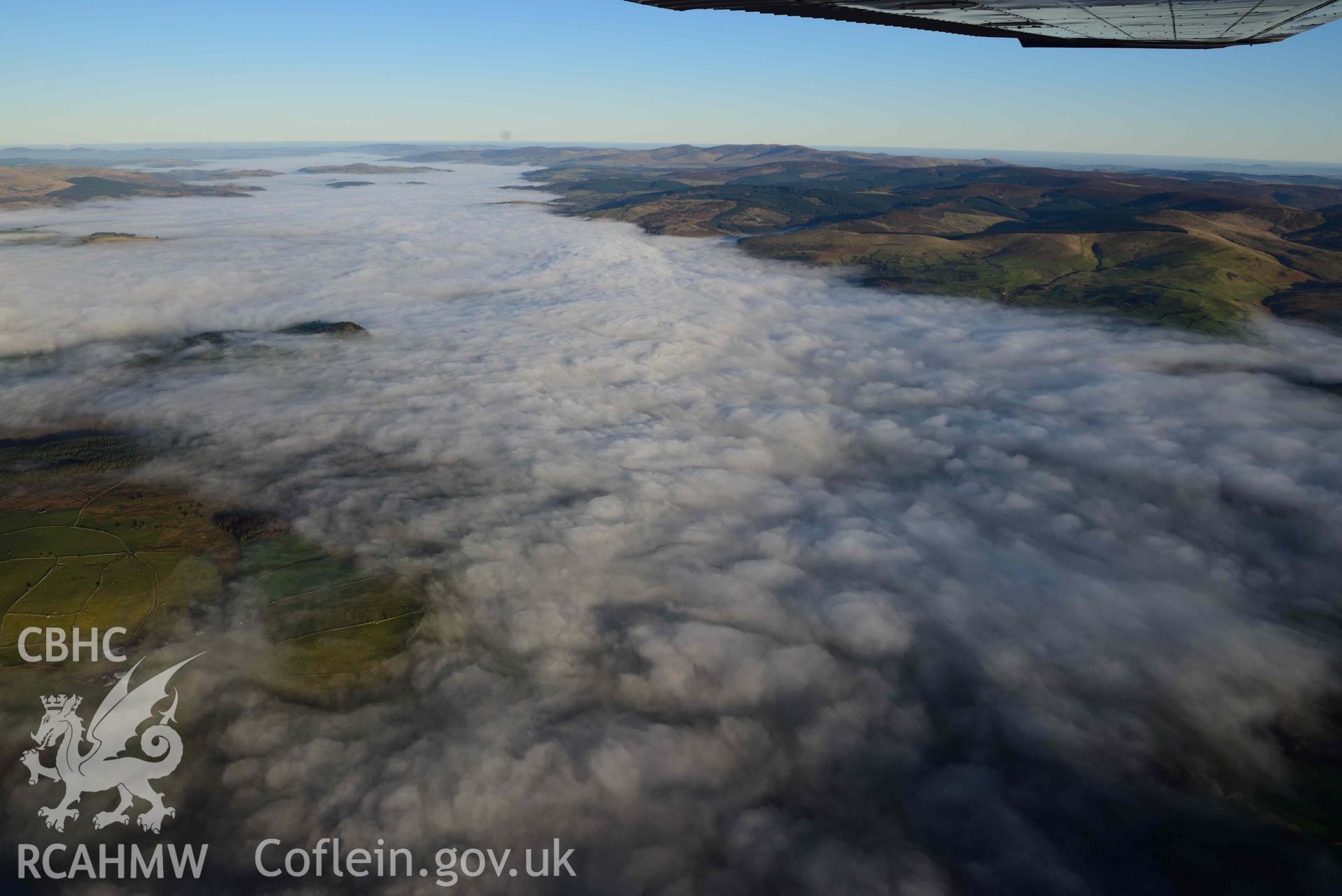 Oblique aerial photograph showing view from the west of cloud inversion over Llyn Tegid/Bala Lake. Taken during the Royal Commission’s programme of archaeological aerial reconnaissance by Toby Driver on 17th January 2022