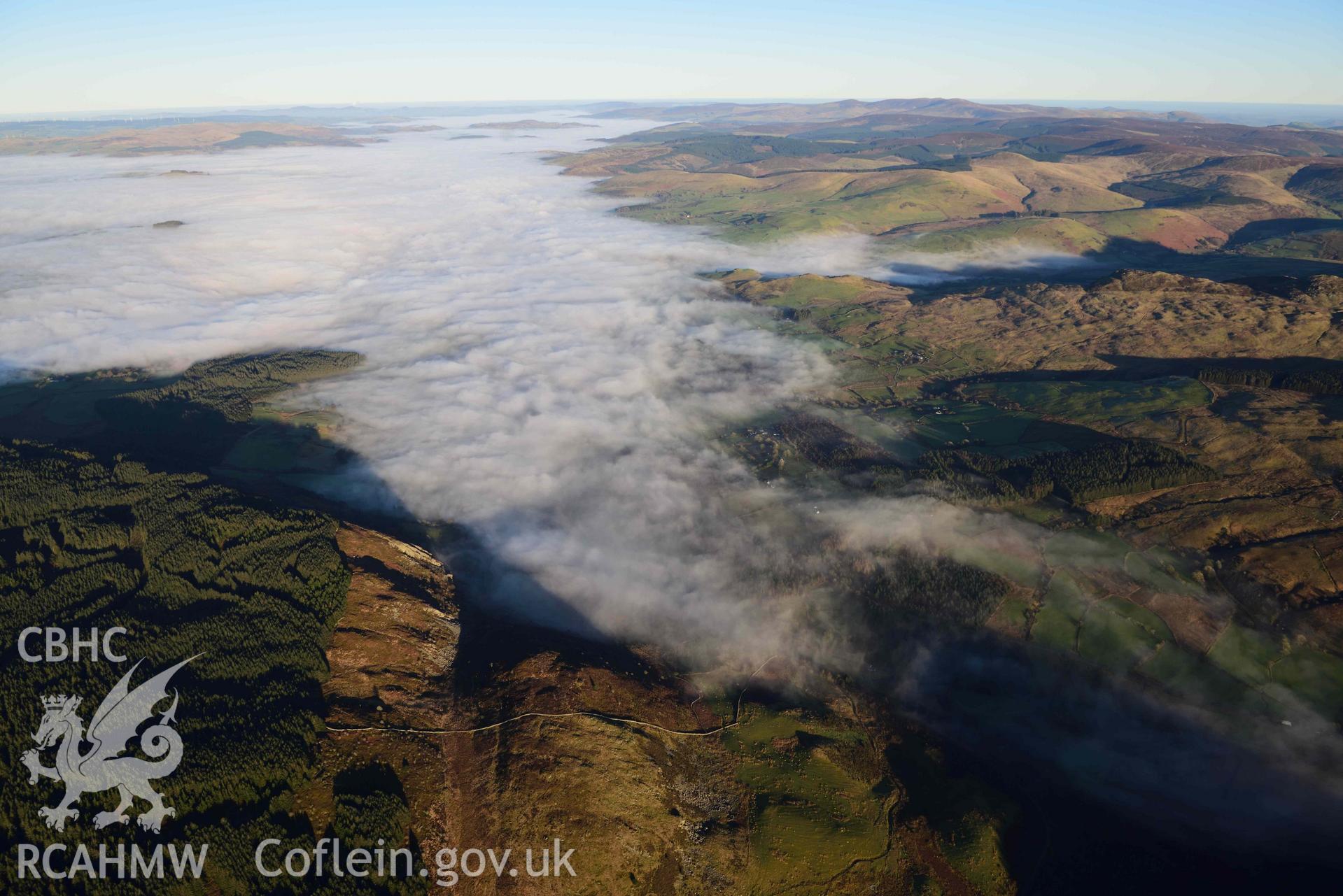 Oblique aerial photograph showing view from the west over Llanuwchllyn of cloud inversion over Llyn Tegid/Bala Lake. Taken during the Royal Commission’s programme of archaeological aerial reconnaissance by Toby Driver on 17th January 2022