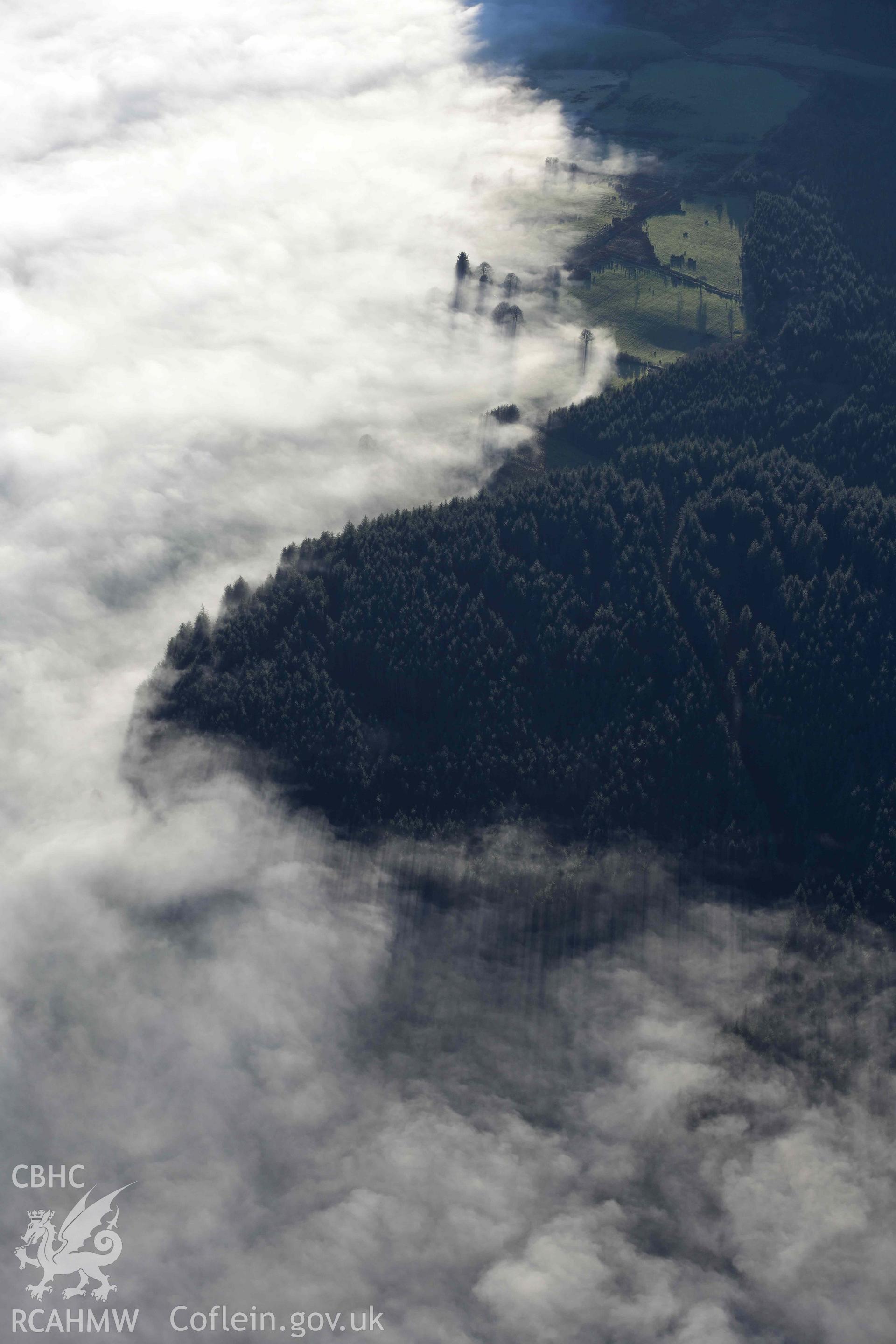 Oblique aerial photograph of cloud inversion west of Llanuwchllyn, viewed from the north. Taken during the Royal Commission’s programme of archaeological aerial reconnaissance by Toby Driver on 17th January 2022