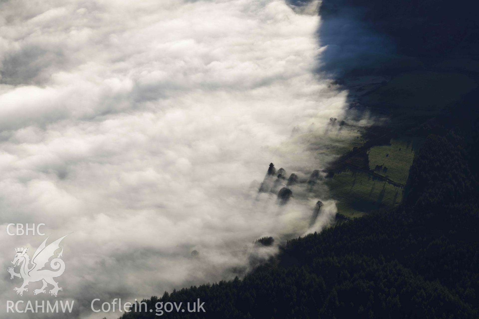 Oblique aerial photograph of cloud inversion west of Llanuwchllyn, viewed from the north. Taken during the Royal Commission’s programme of archaeological aerial reconnaissance by Toby Driver on 17th January 2022
