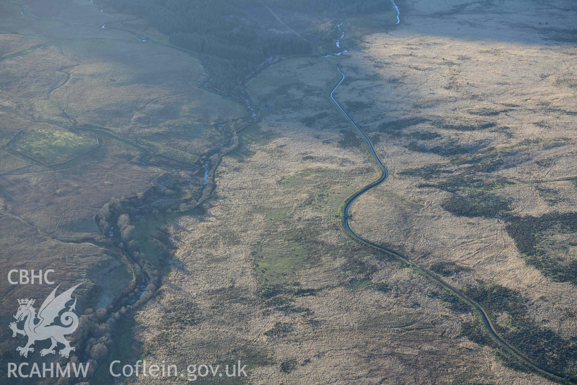 Oblique aerial photograph of Crawcwellt south hut circle settlement taken during the Royal Commission’s programme of archaeological aerial reconnaissance by Toby Driver on 17th January 2022