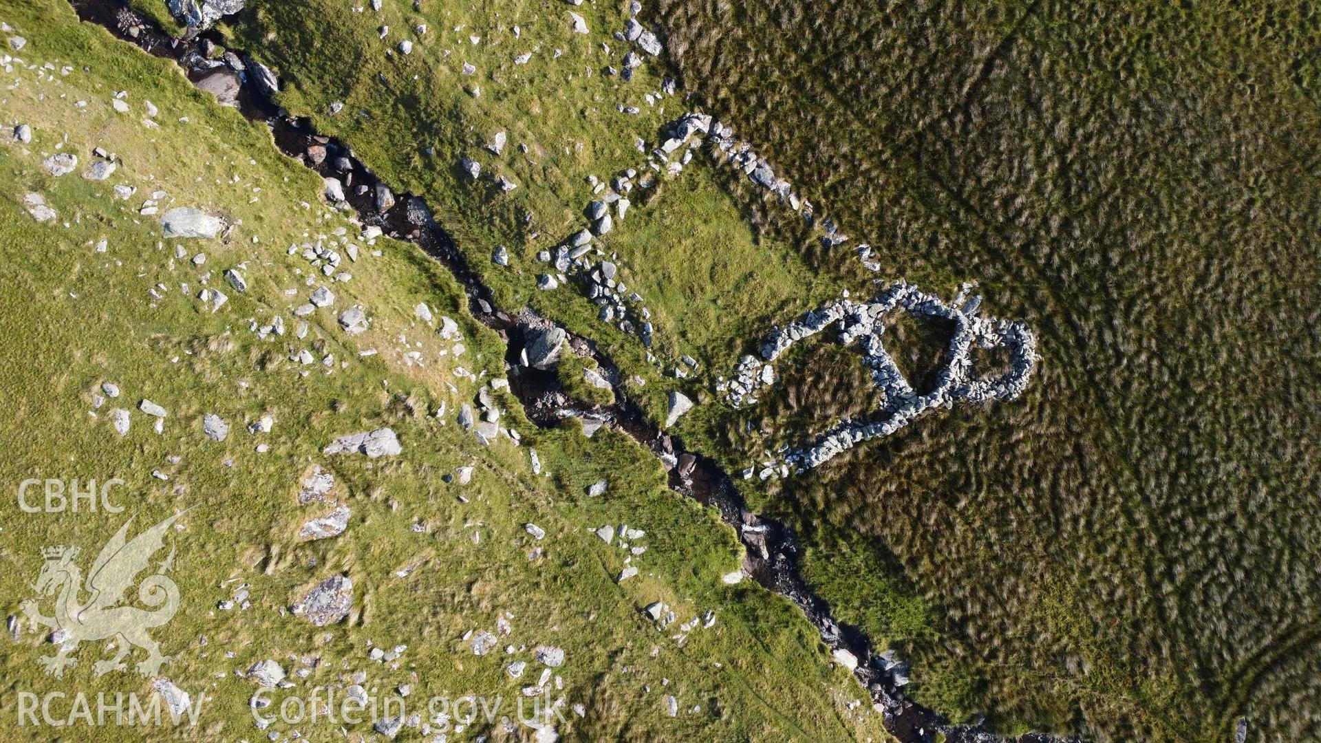 Digital aerial photograph showing multicellular sheep fold, Afon Berthen. Taken in July 2023 by John Rowlands.