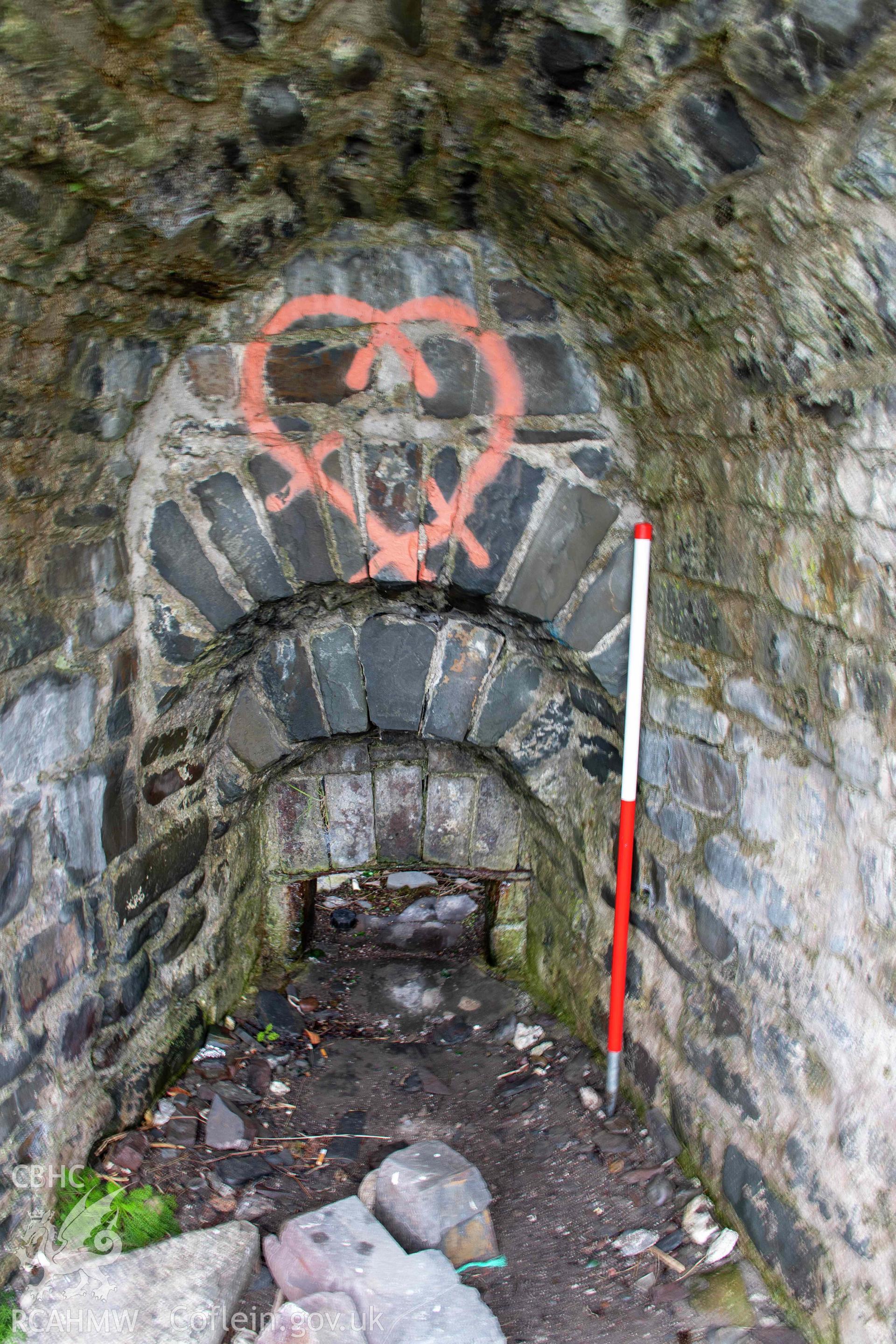 Wallog Limekiln. Draw-hole, west kiln-eye (with scale).