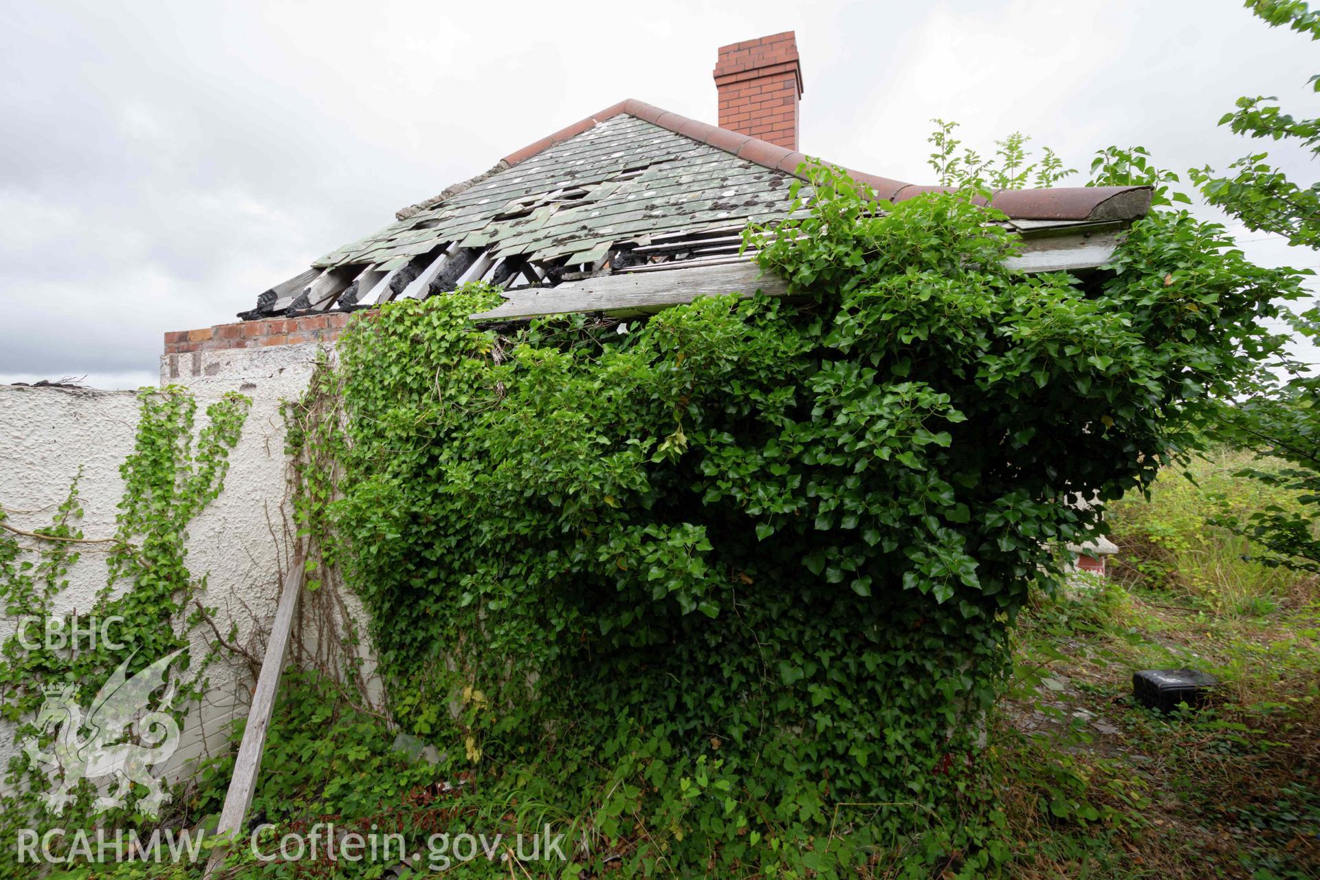 Caretaker's bungalow exterior. East side overgrowth. St Athan Boys Village.