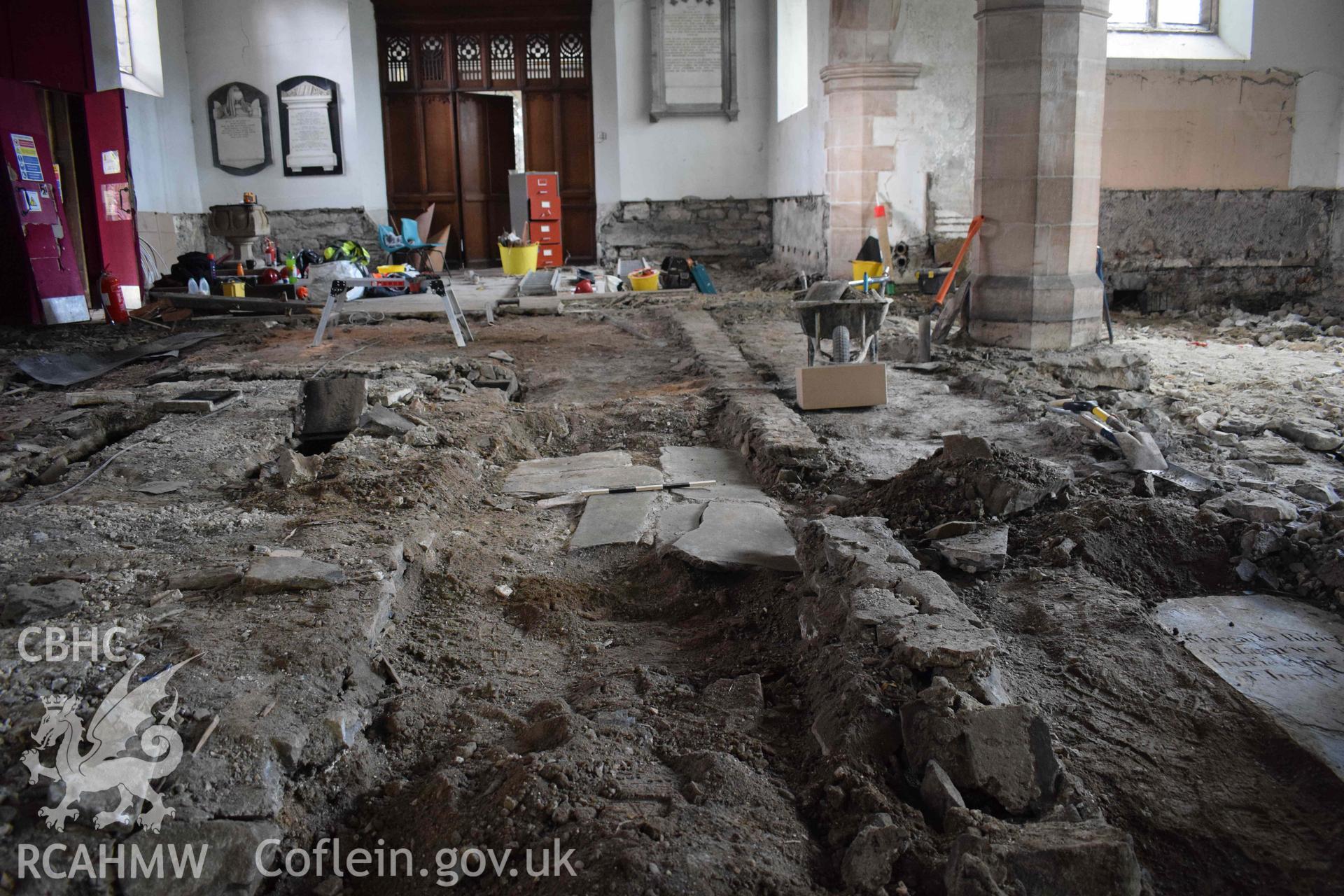 Photograph showing remains of the 18th-century floor within the nave, from the east. taken during an Archaeological Watching Brief carried out during refurbishment works at St Grwst’s Church and Gwydir Chapel, Llanrwst,, by Clwyd-Powys Archaeological Trust in 2019-2020. ref: CPAT 4679-0033, Project no. 2399.