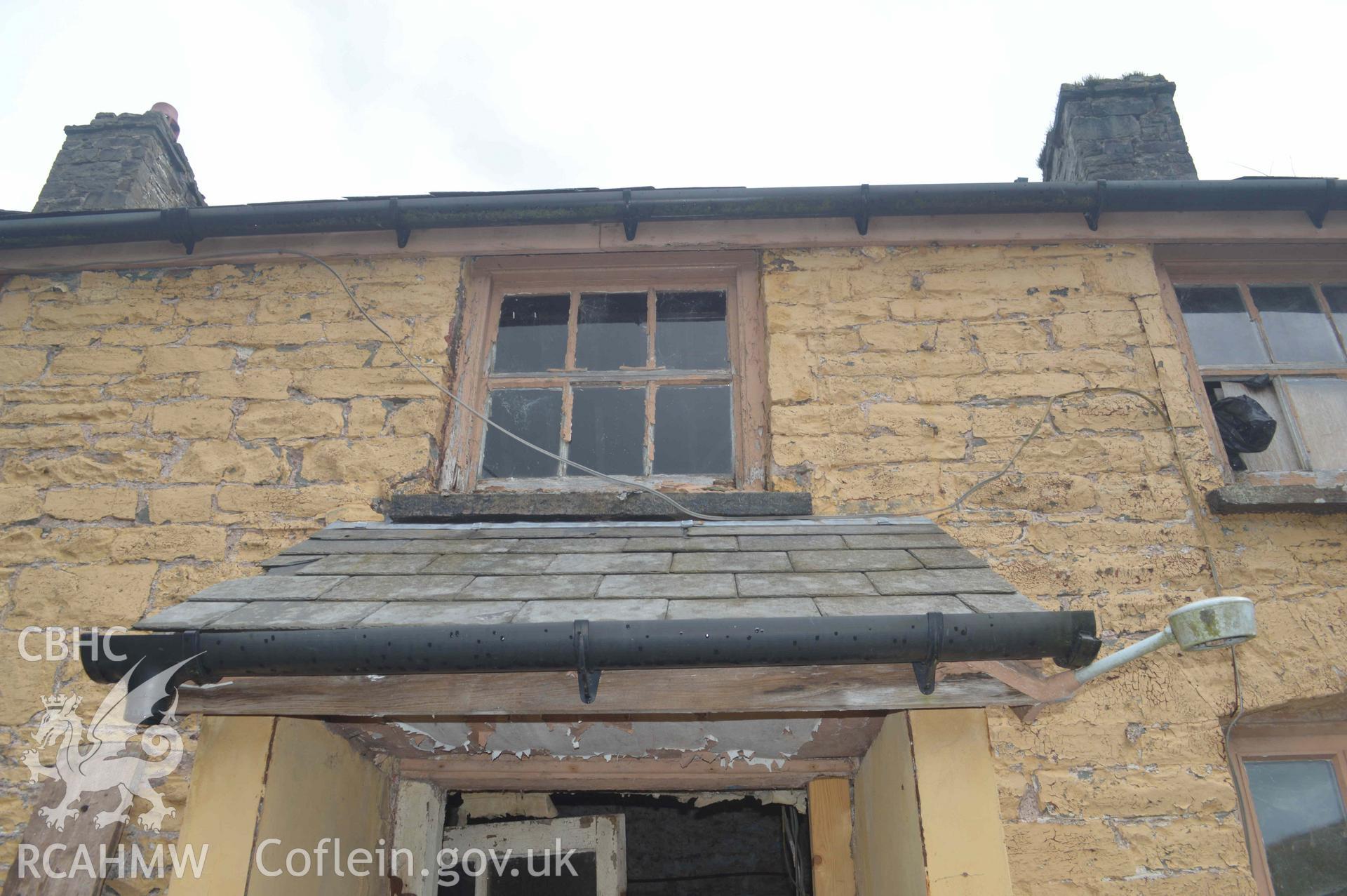 Photograph showing View of window above porch in W wall, from a Level 3 historic building recording of Felincamlais Farm, Libanus, carried out by Clwyd-Powys Archaeological Trust in 2022. Report no: 1899, Project no. 2651.