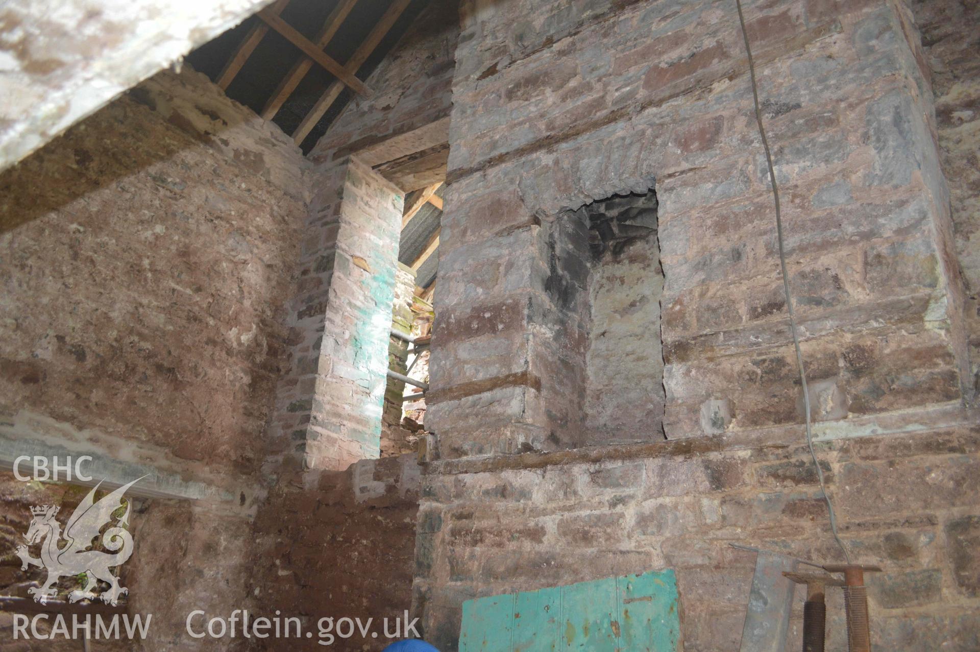 Photograph showing View of north gable fireplace, from a Level 3 historic building recording of Felincamlais Farm, Libanus, carried out by Clwyd-Powys Archaeological Trust in 2022. Report no: 1899, Project no. 2651.