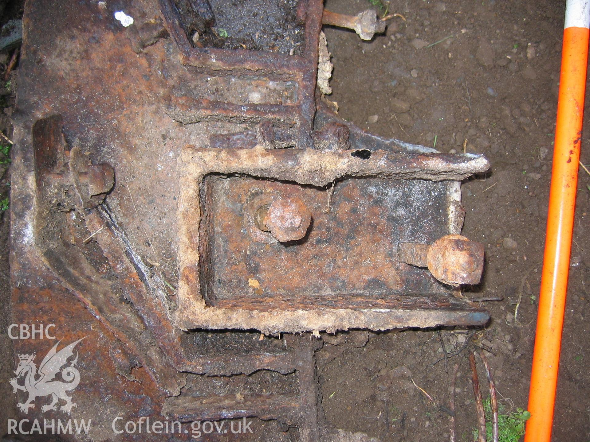 Digital photograph showing part of a disused item of mill machinery.