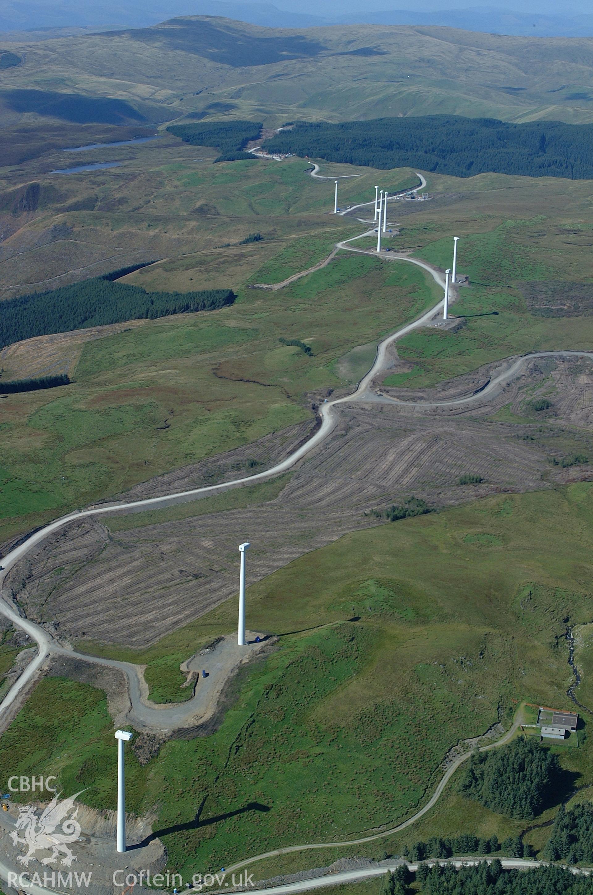 RCAHMW colour oblique aerial photograph of Cefn Croes Wind Farm during construction, from the south-east. Taken on 31 August 2004 by Toby Driver