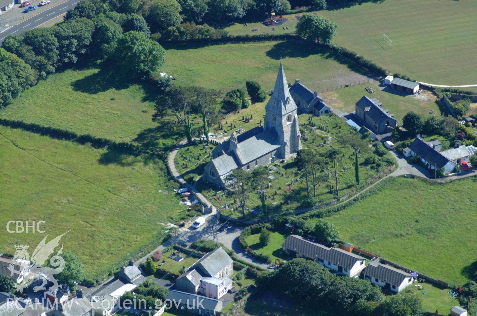 RCAHMW colour oblique aerial photograph of St Rhystud's Church, Llanrhystud taken on 14/06/2004 by Toby Driver