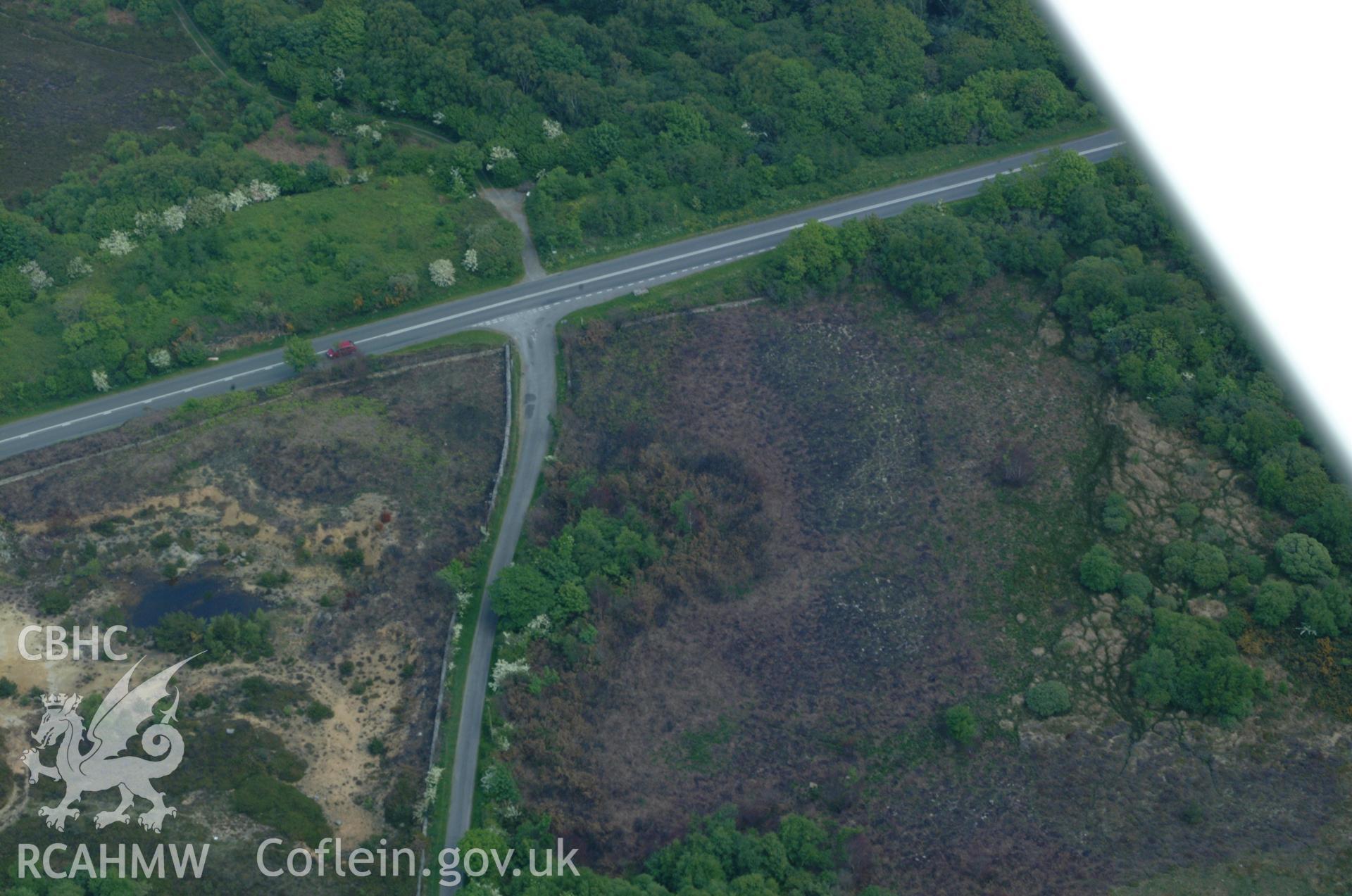 RCAHMW colour oblique aerial photograph of a burnt mound west of Plas Lligwy taken on 26/05/2004 by Toby Driver
